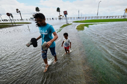 Kids play in the floodwaters from Tropical Storm Bertha in New Orleans, Louisiana, last month. The storm was one of two named storms in the Atlantic this year
