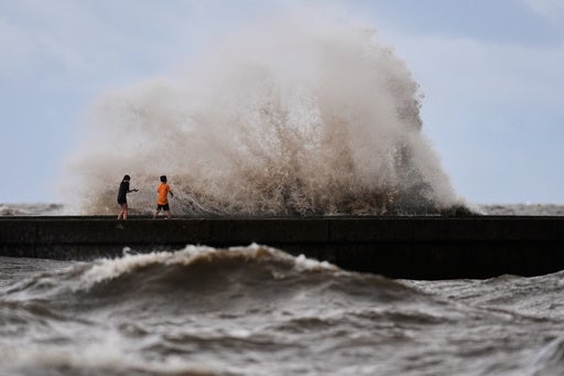 Children play near breaking waves from Tropical Storm Bertha in New Orleans, Louisiana, last month. There have been no hurricanes in the Atlantic yet