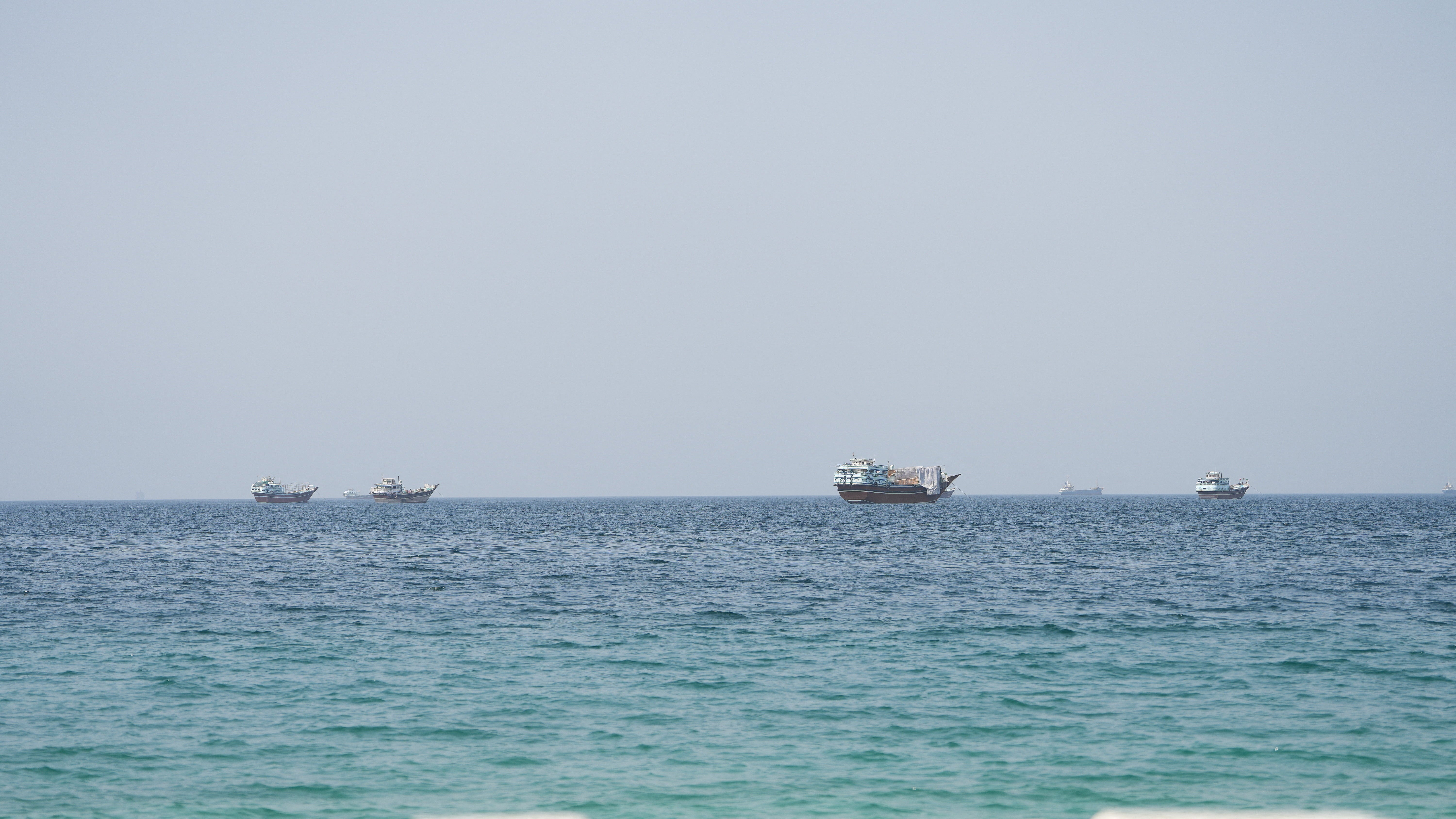 Vessels near the Strait of Hormuz, as seen from Musandam, Oman, August 6 (Reuters)