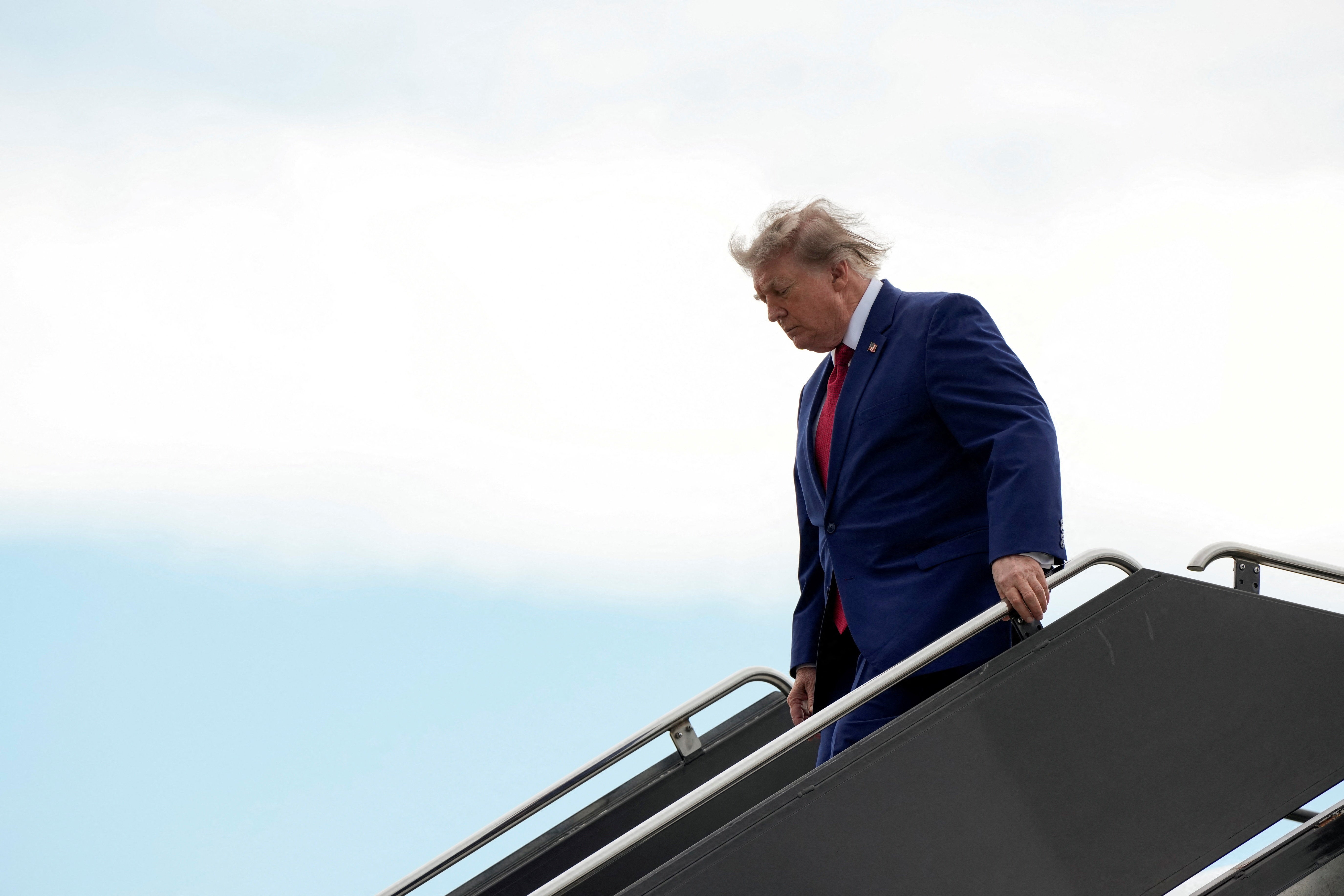 Donald Trump disembarks Air Force One in New Jersey on 7 August. The president continues to insist a deal is coming with Iran to reopen the Strait of Hormuz