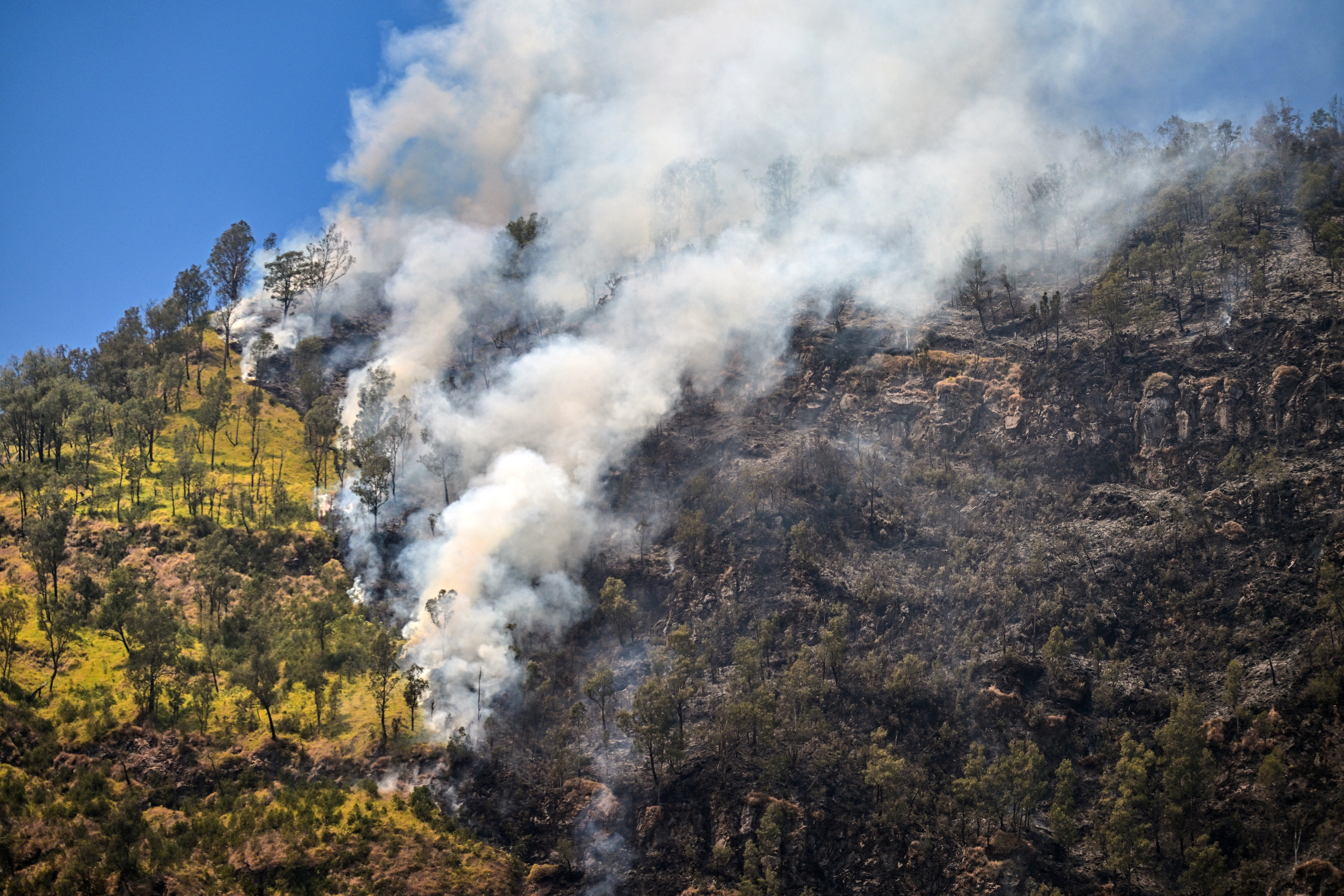 A wildfire burns in Bromo Tengger Semeru National Park near Mount Bromo in Probolinggo, East Java province on 6 August 2026