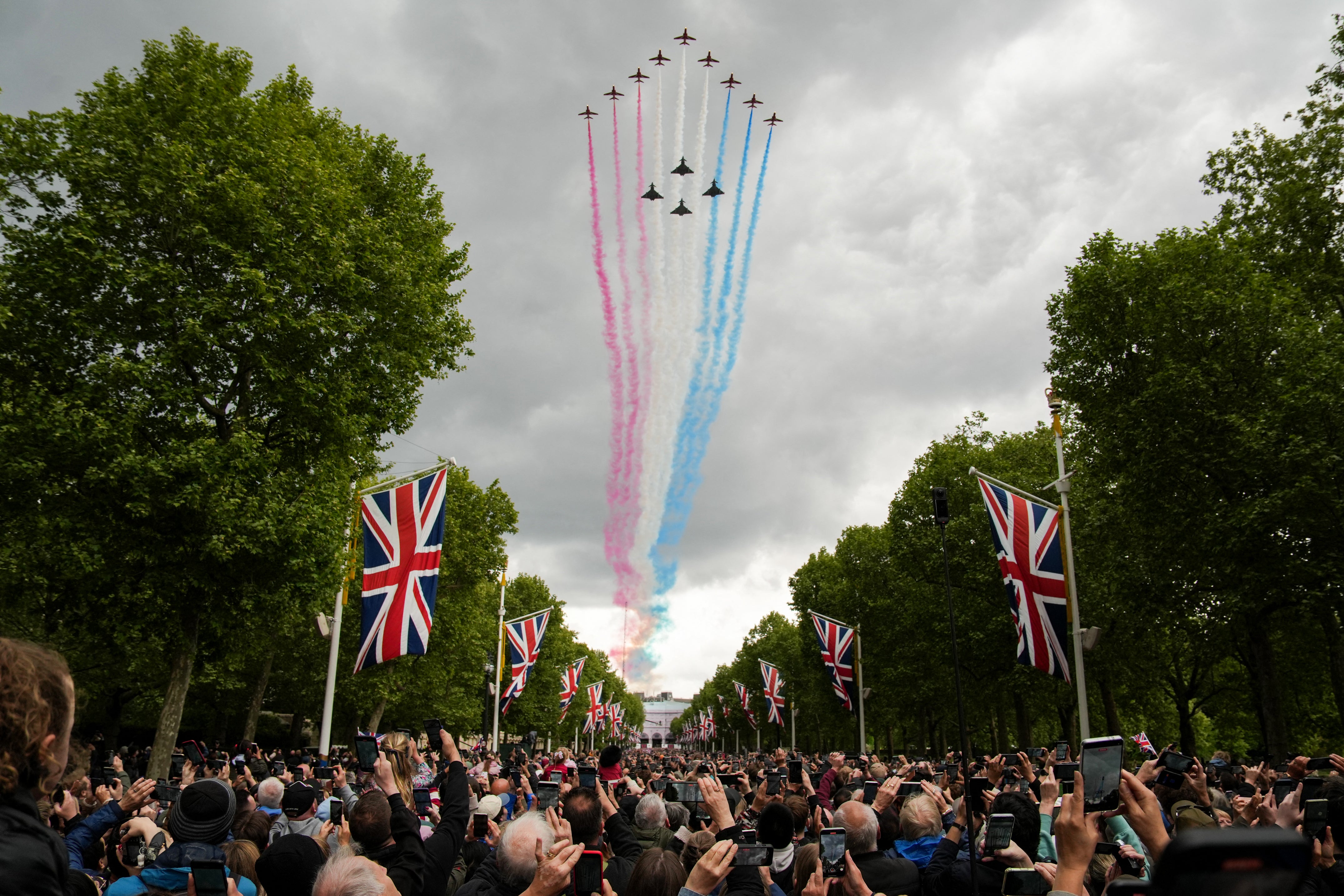 The the Red Arrows fly over the Mall towards from Buckingham Palace following the armed forces procession on 5 May 2025 to celebrate the 80th anniversary of VE Day