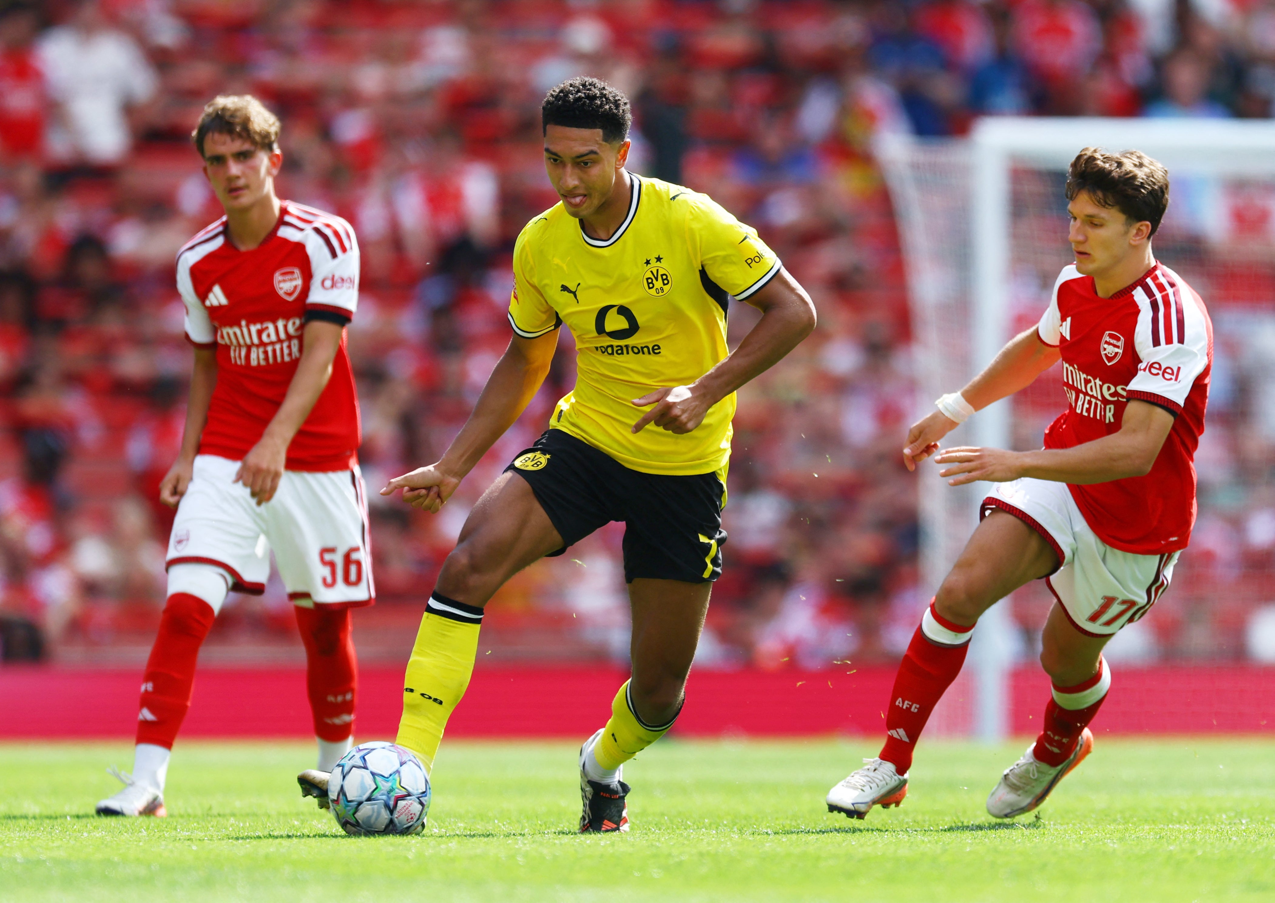 Borussia Dortmund's Jobe Bellingham in action with Arsenal's Christos Tzolis