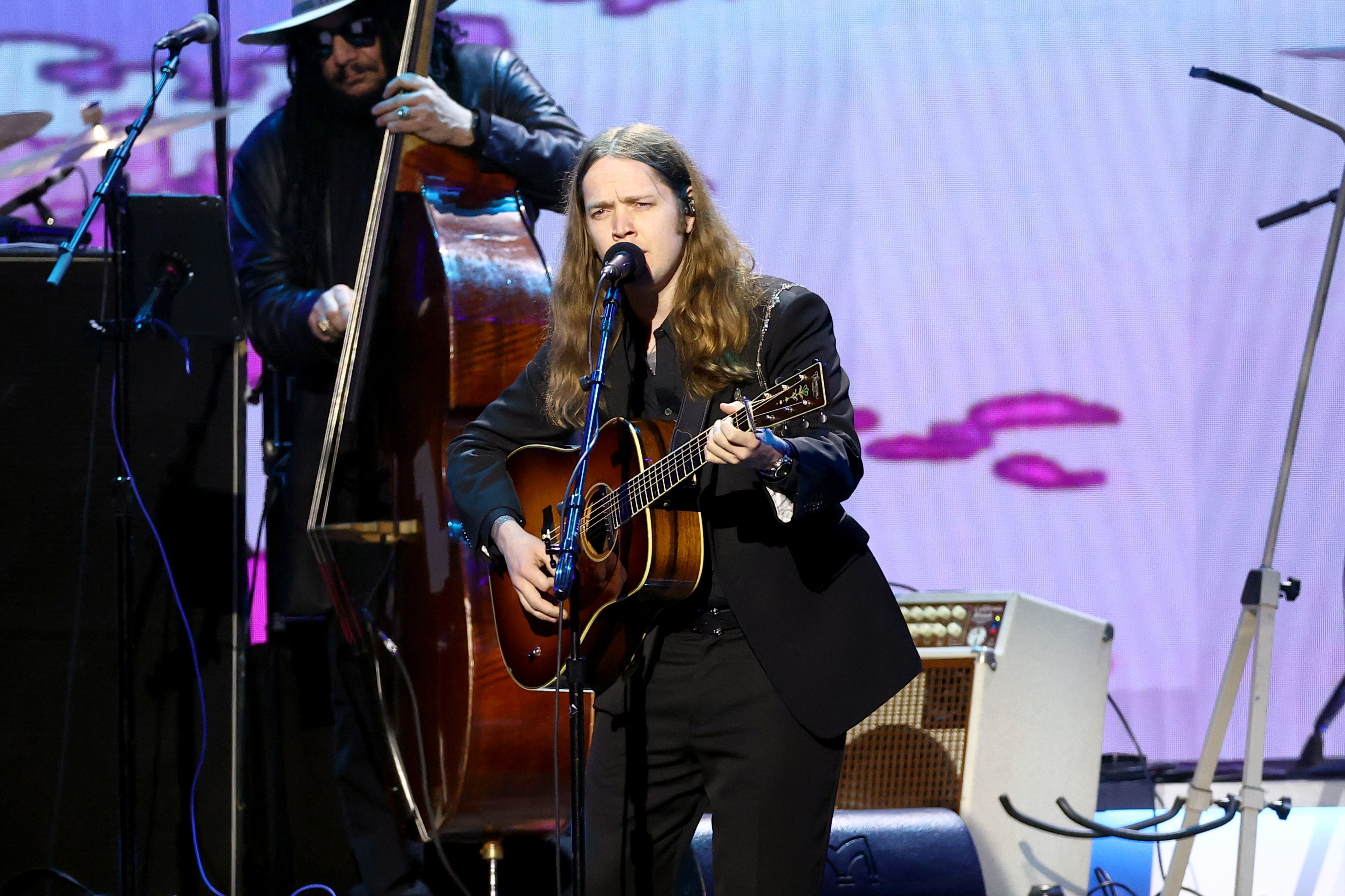 Billy Strings performs in protective helmet after being struck by object on stage the night before