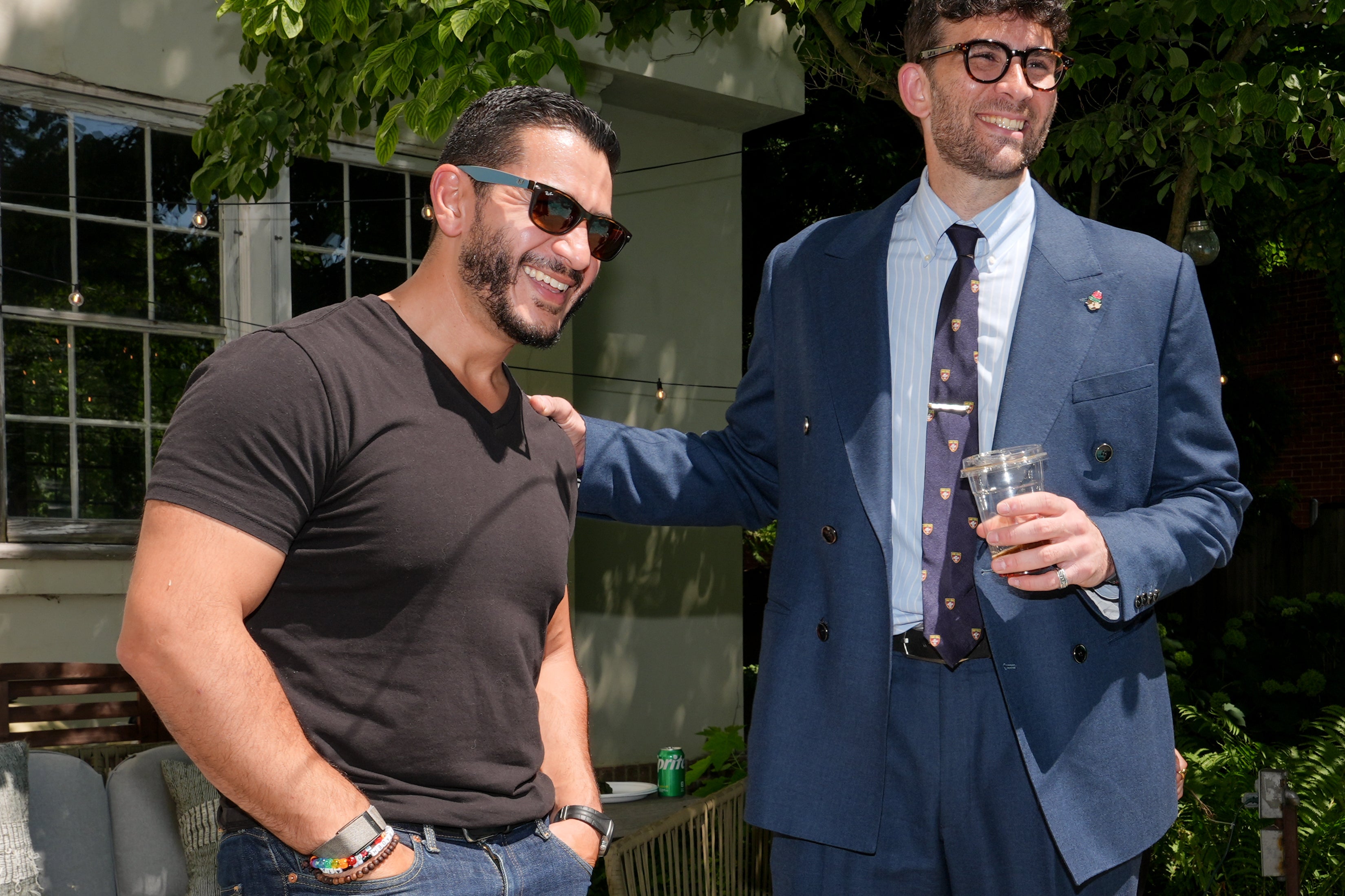 El-Sayed talks poolside with streamer Hasan Piker at a party for content creators supporting his campaign on Aug. 3 in Detroit