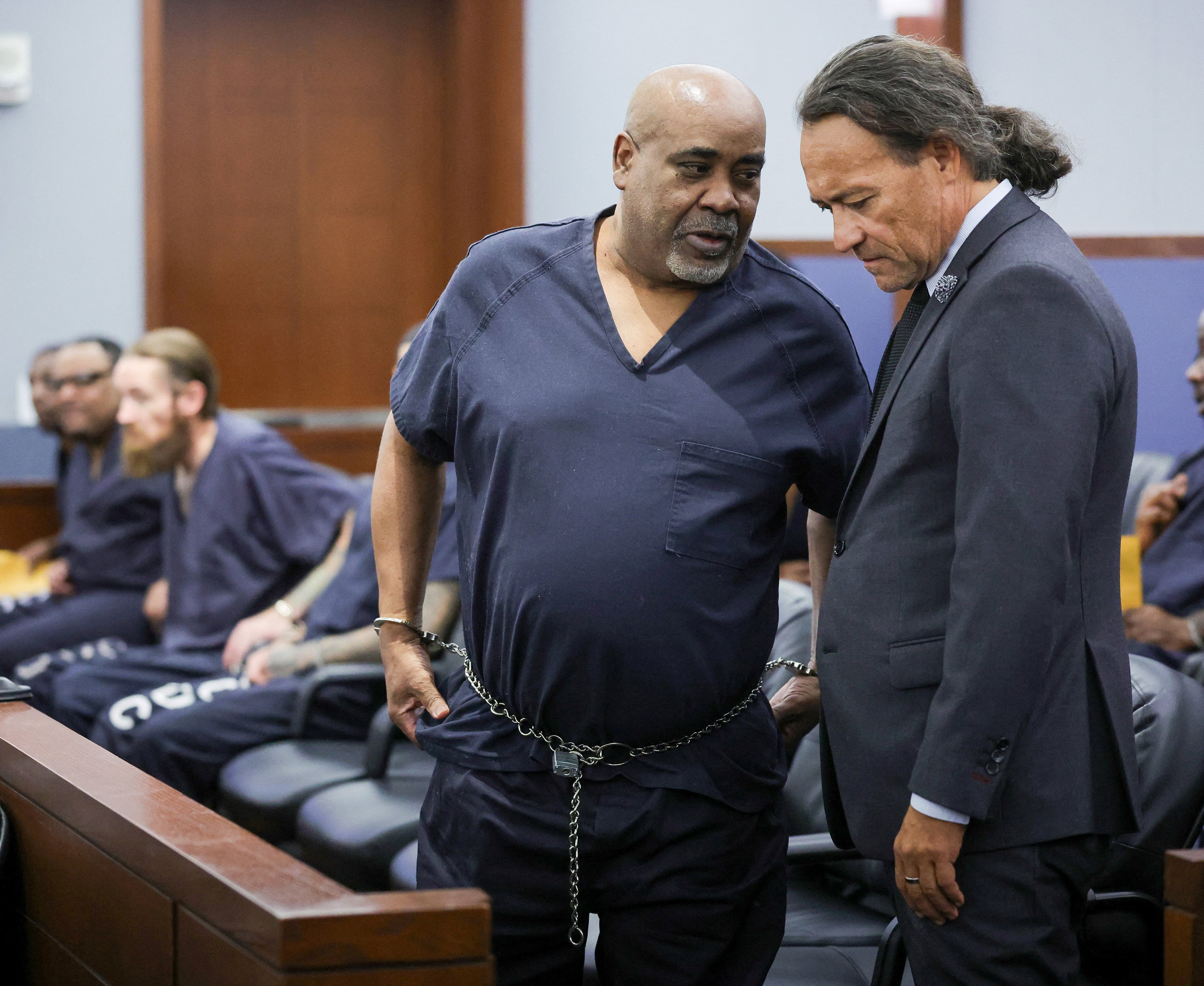 Duane Davis talks with his attorney Michael Sanft during a calendar call and motion hearing for his upcoming trial