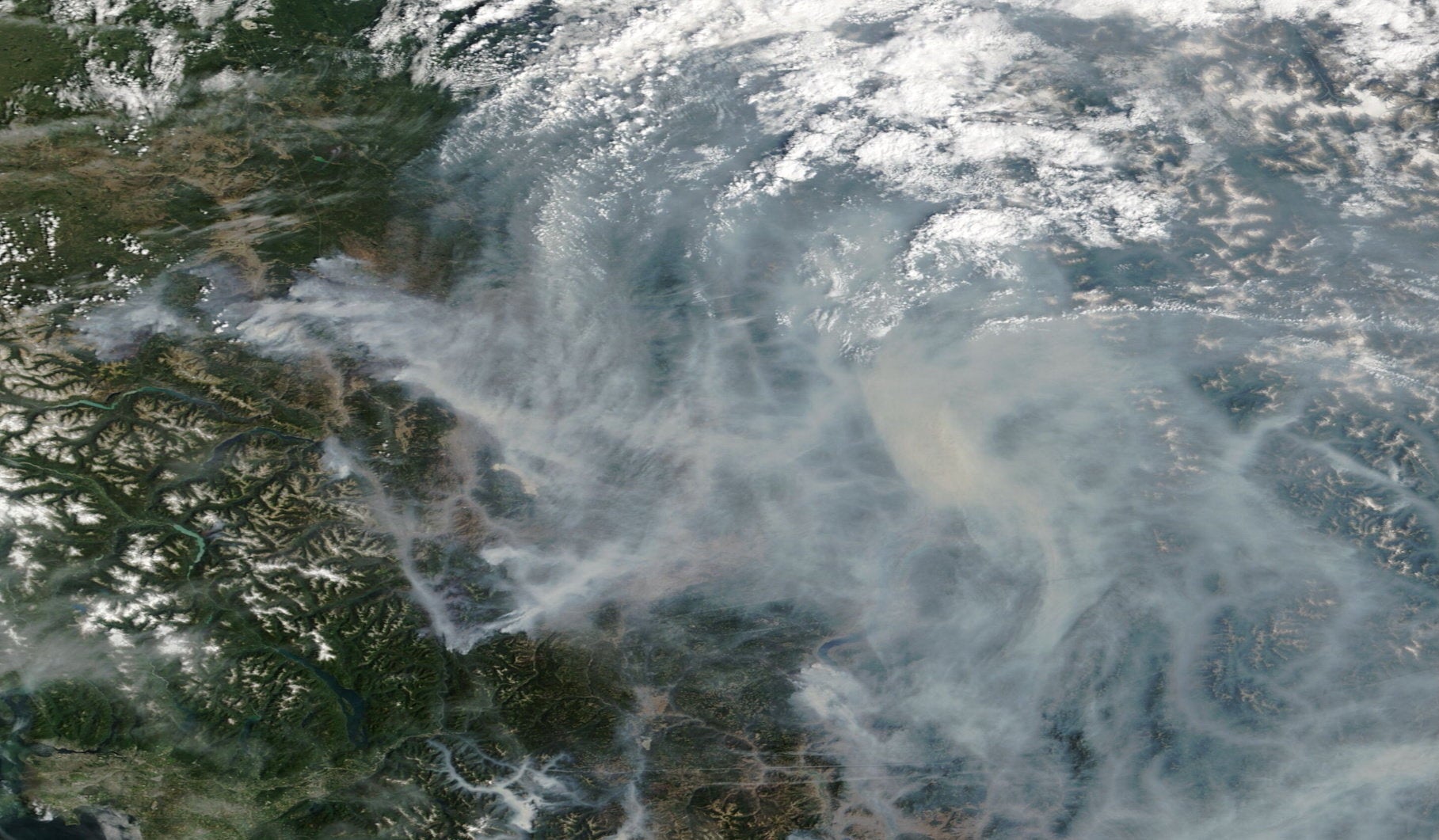 A satellite image shows smoke from wildfires in British Columbia, Canada, August 9