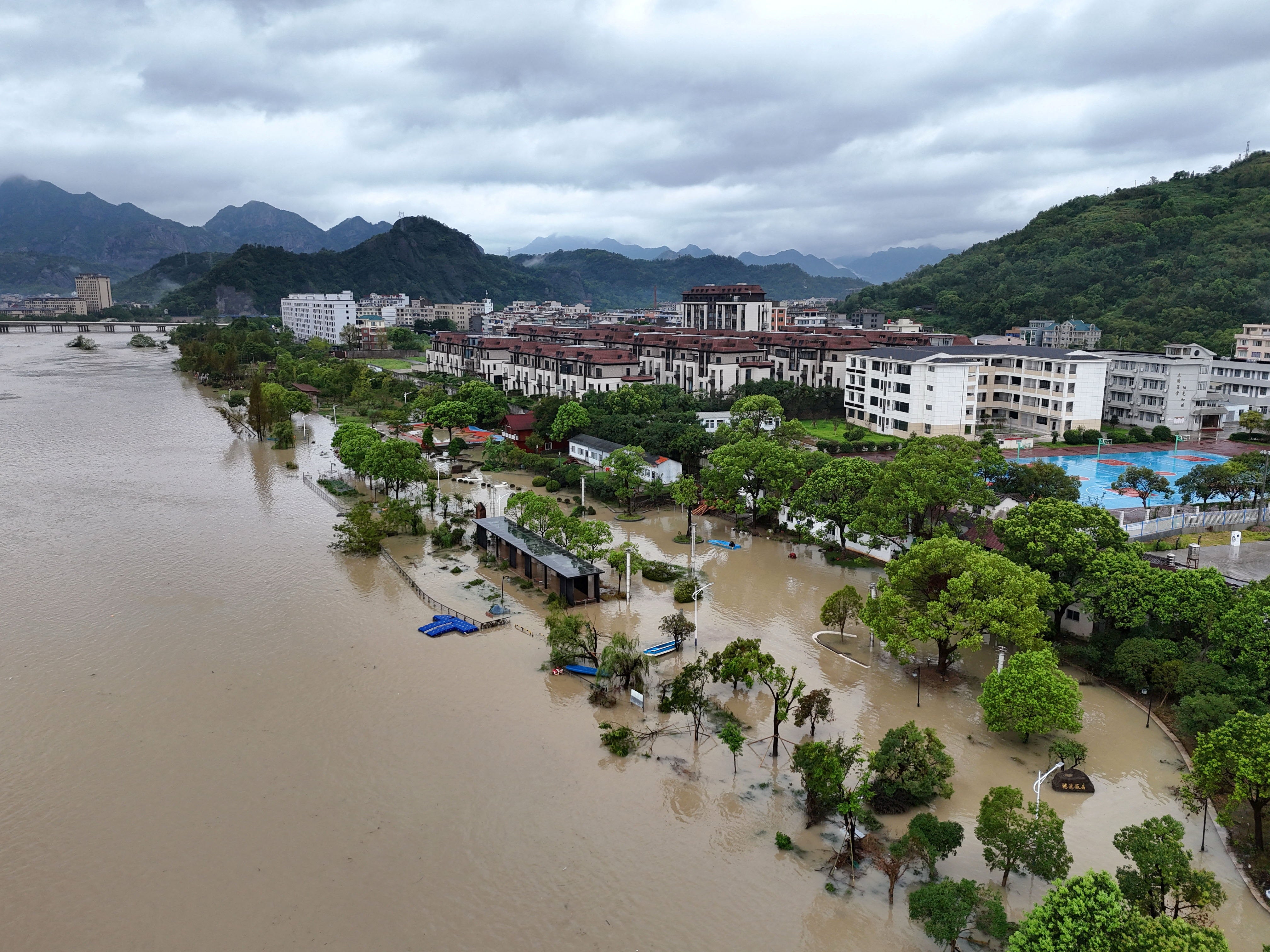 A drone view shows a flooded village following heavy rainfall brought by Typhoon Dolphin, in Dajing town, Yueqing, Zhejiang province, China on 10 August