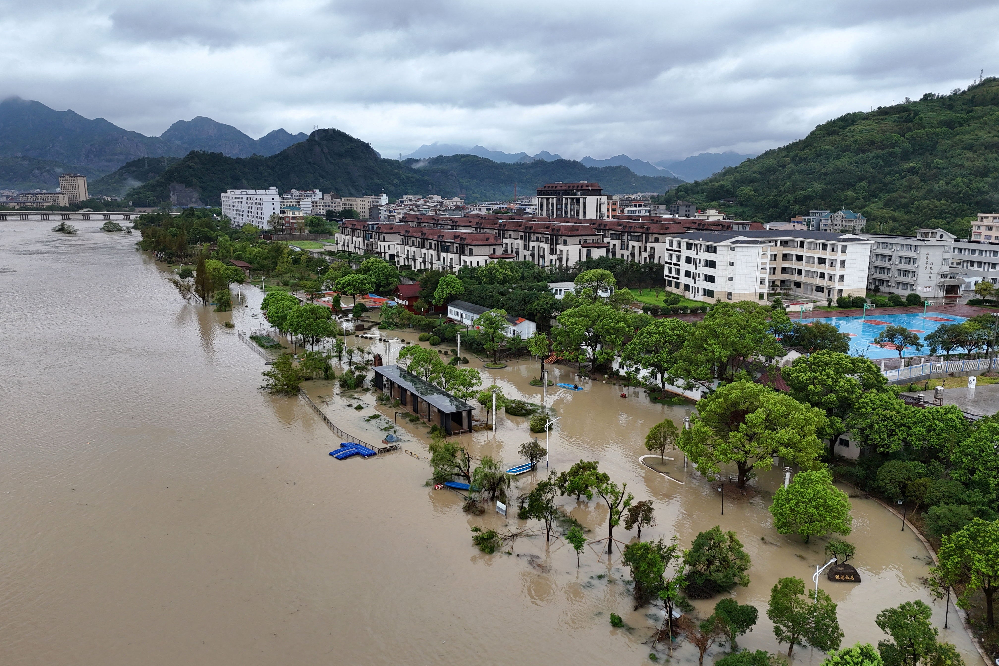A drone view shows a flooded village following heavy rainfall brought by Typhoon Dolphin, in Dajing town, Yueqing, Zhejiang province, China on 10 August (Reuters)