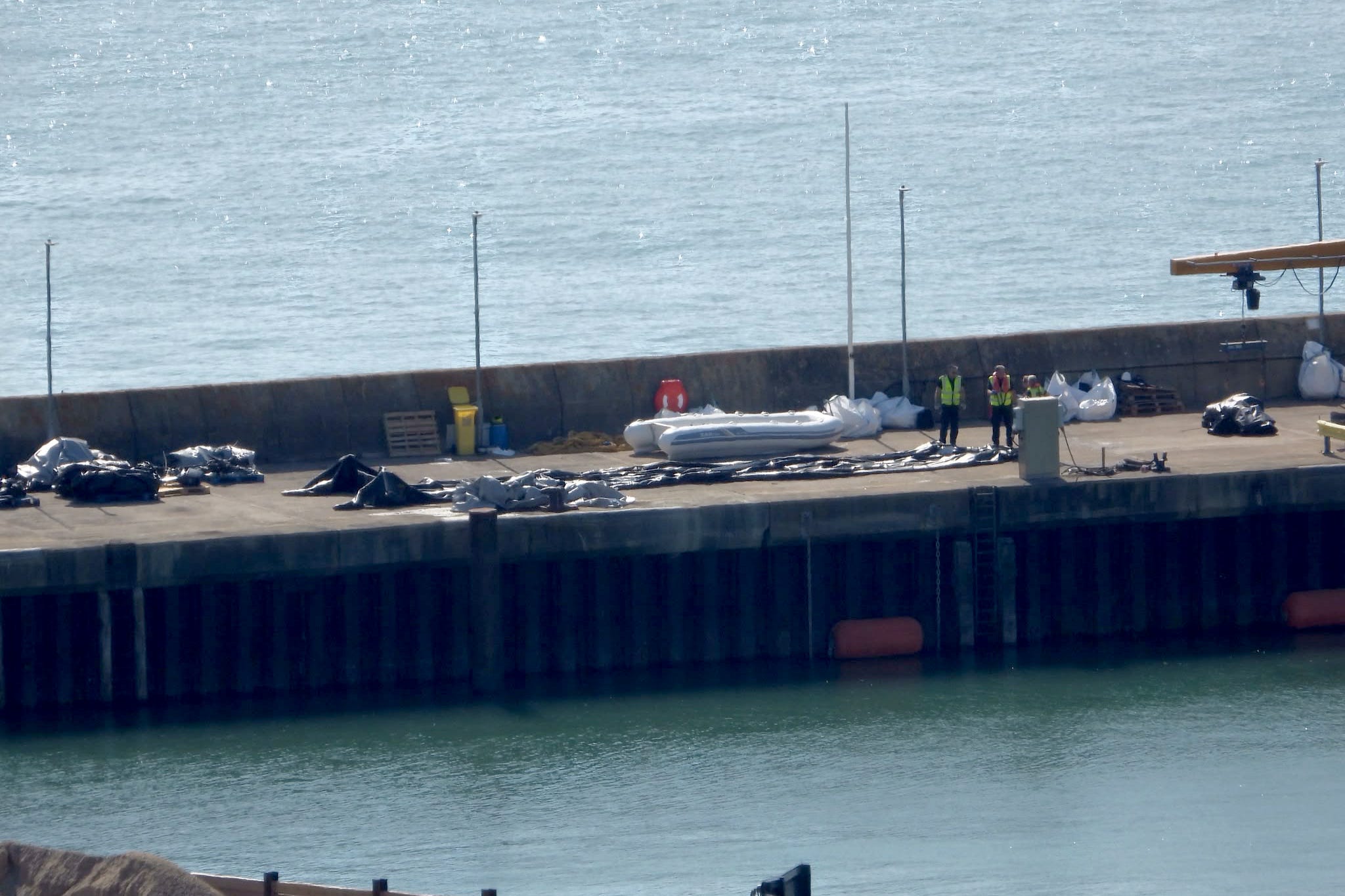 Record 230-migrant boat was buckling and nearly led to tragedy, rescuers say; 30 people ended up in water during rush to board