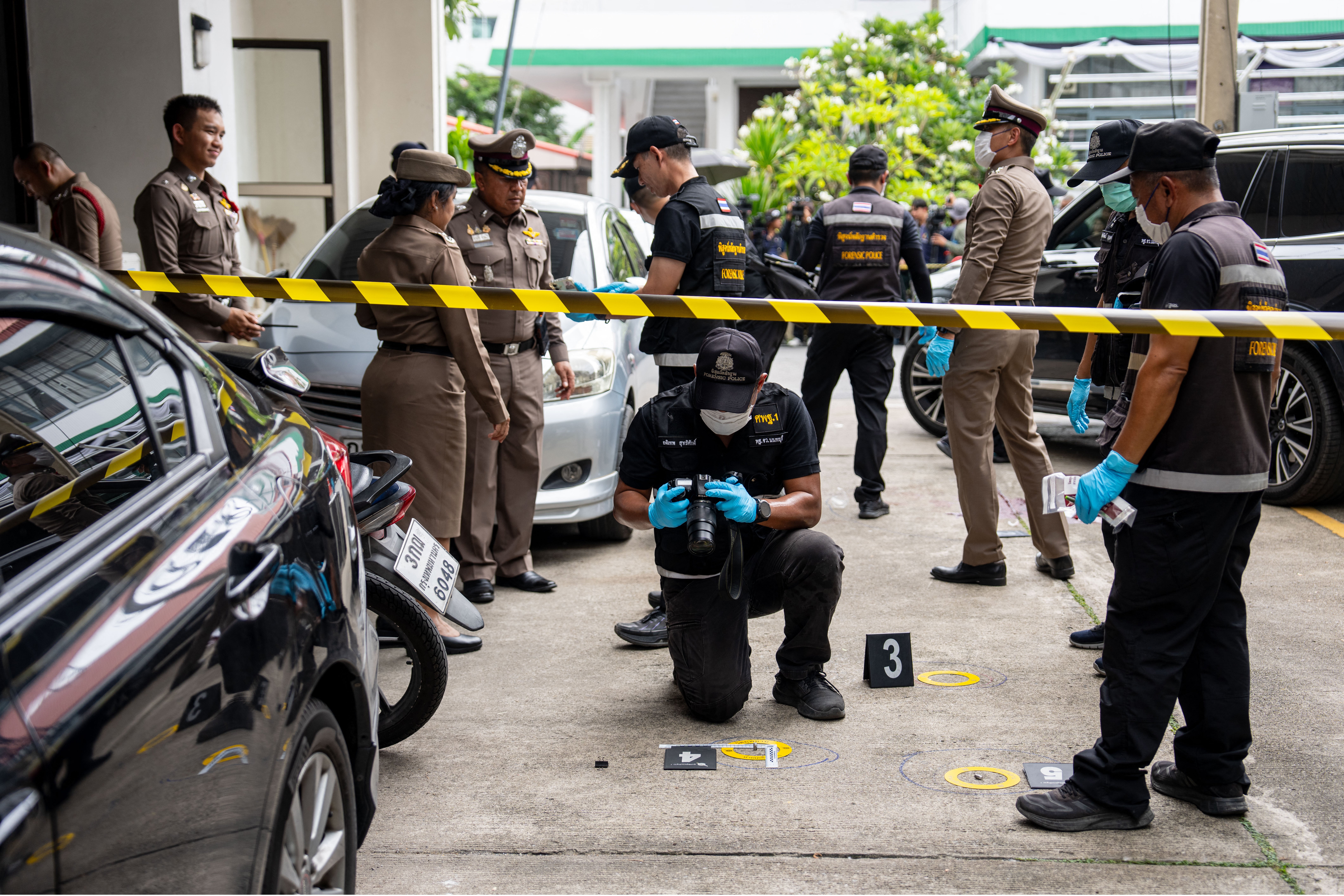 Police officers gather evidence at the Nonthaburi Provincial Administrative Organisation office north of Bangkok (AFP/Getty)