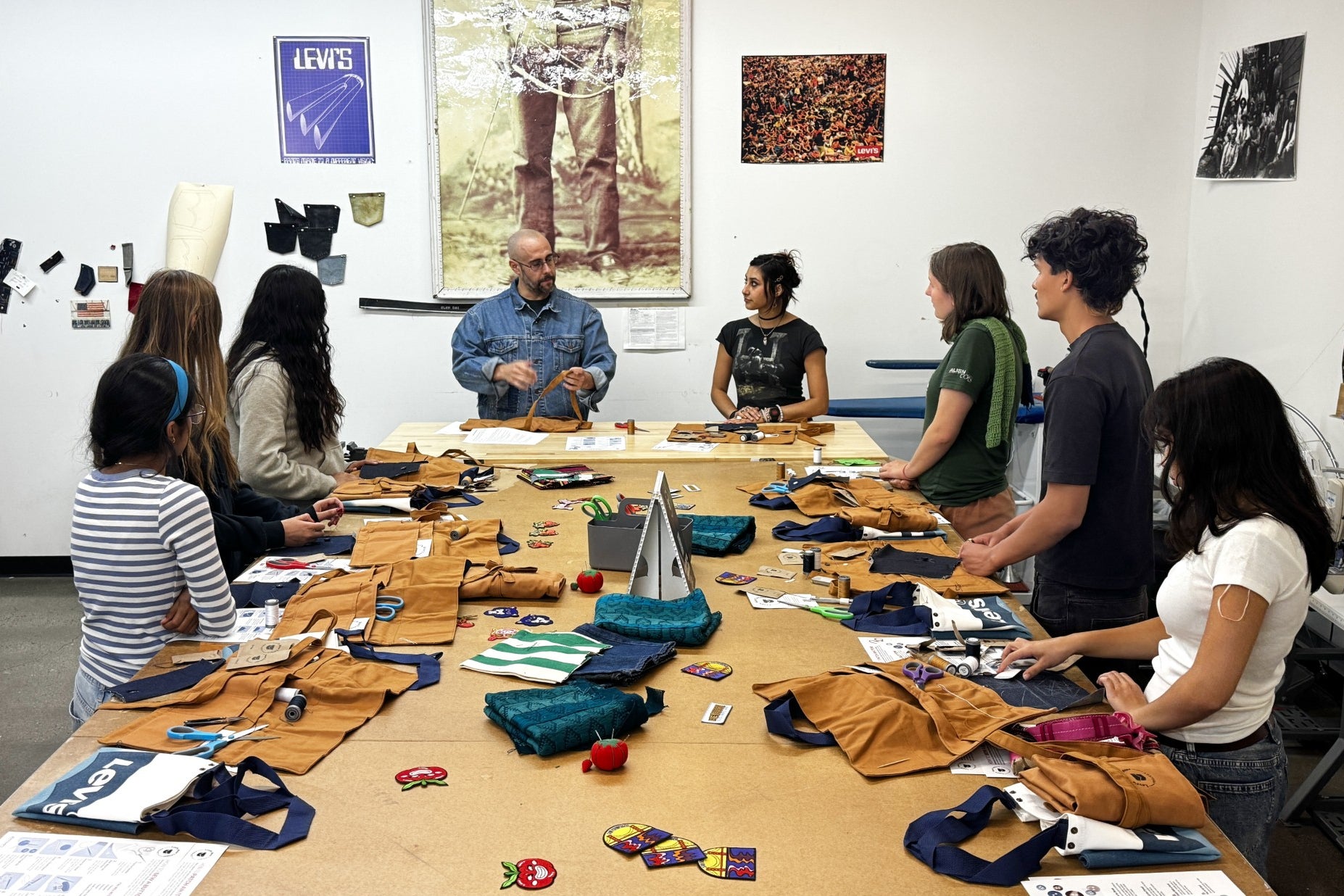 Levi’s employees teach students during a sewing workshop at a Levi's retail store in downtown San Francisco (AP Photo/Terry Chea)