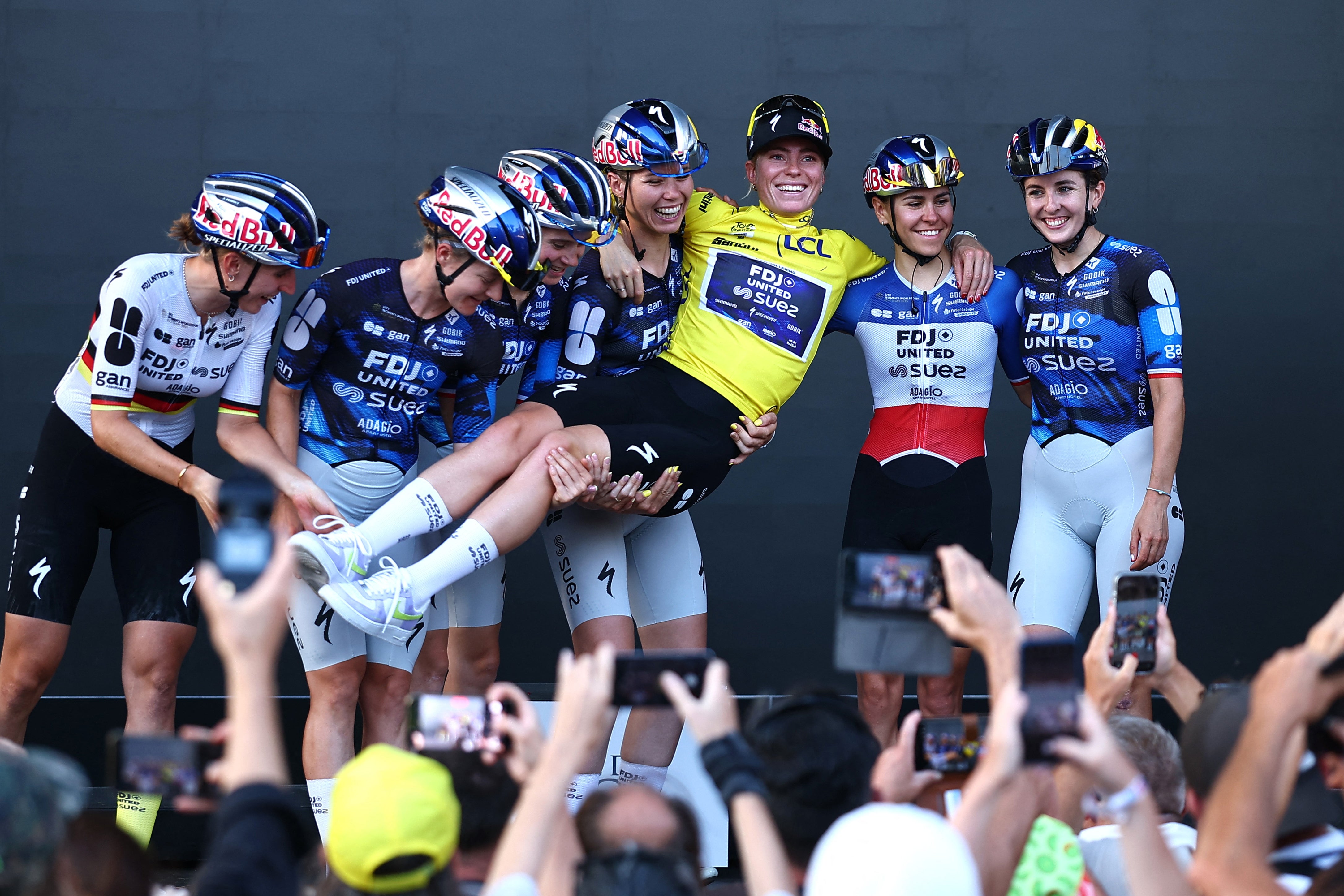 Vollering celebrated with her teammates after winning three stages and the overall (Reuters)
