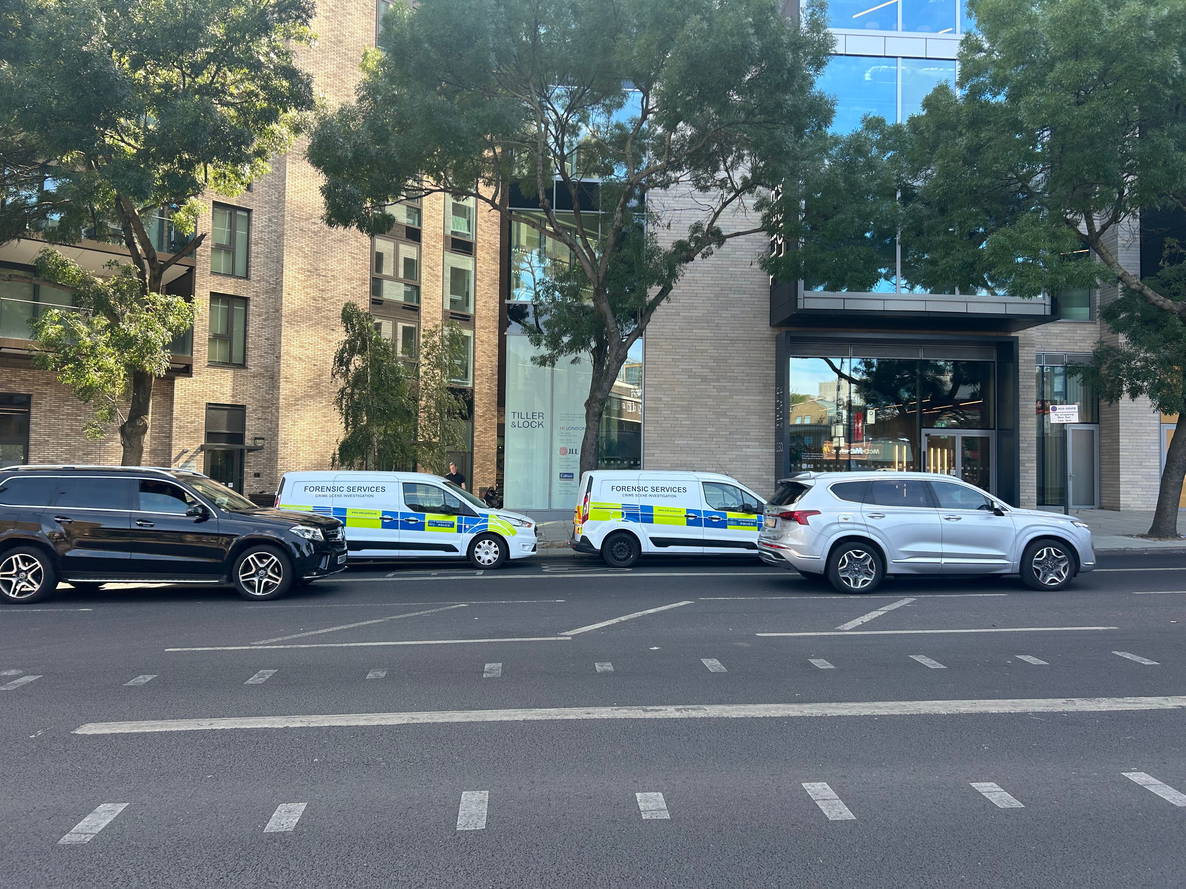 Forensic police vans at the scene at Bollinder Place, Islington
