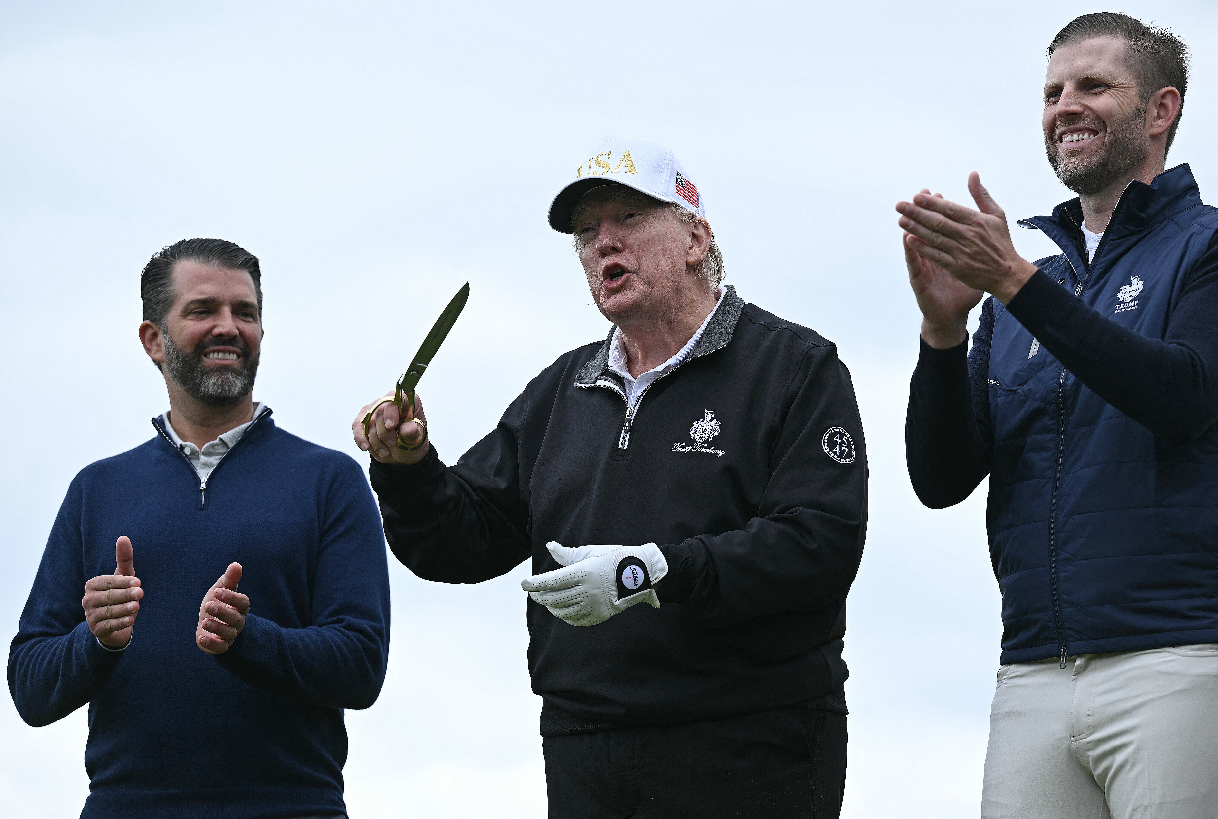 First sons Donald Trump Jr., left, and Eric Trump, right, are running their father’s company while he’s president (AFP/Getty)