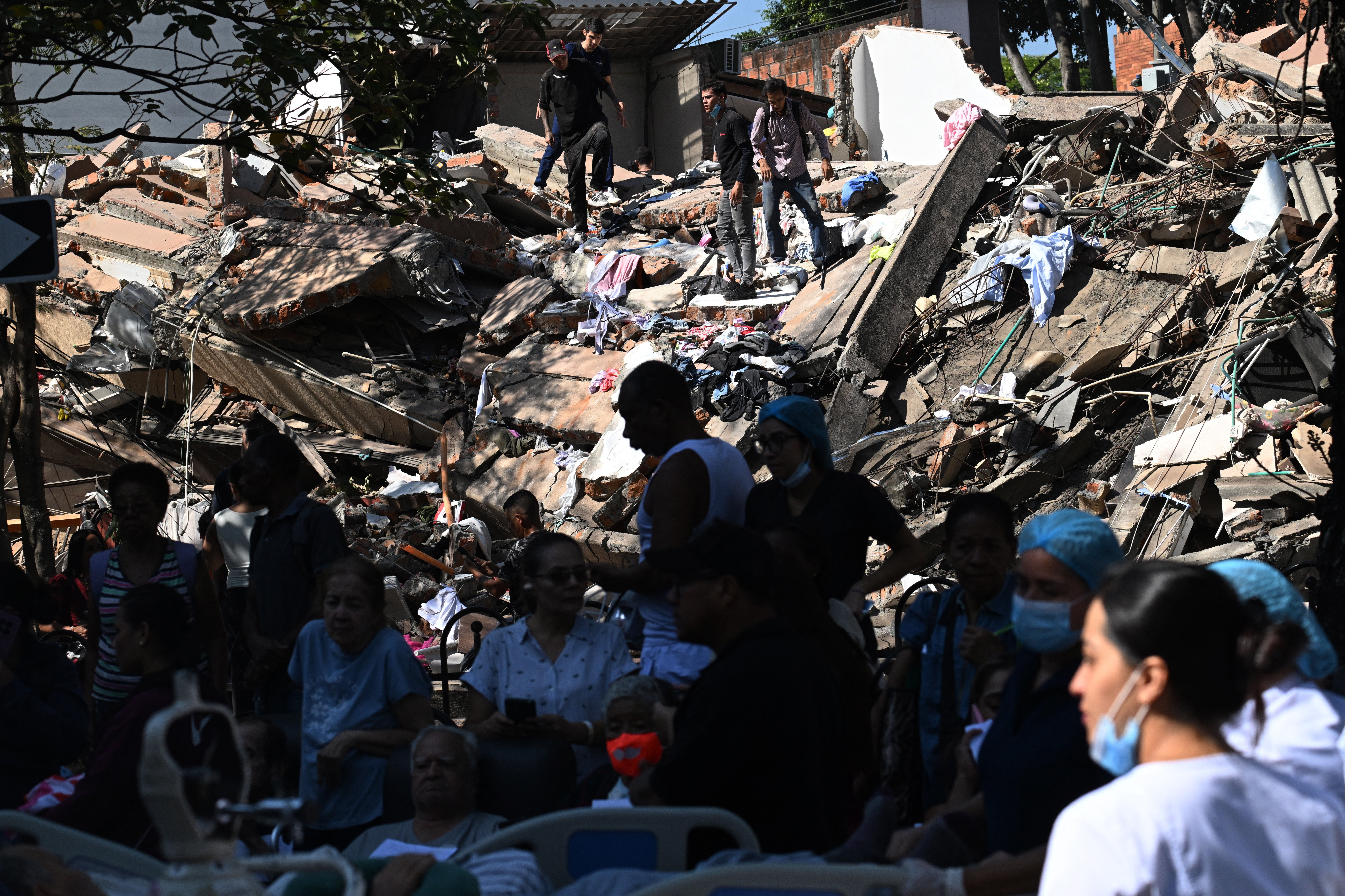 People look for survivors amid the rubble of a collapsed building after an earthquake in Cali, Colombia on August 10, 2026.