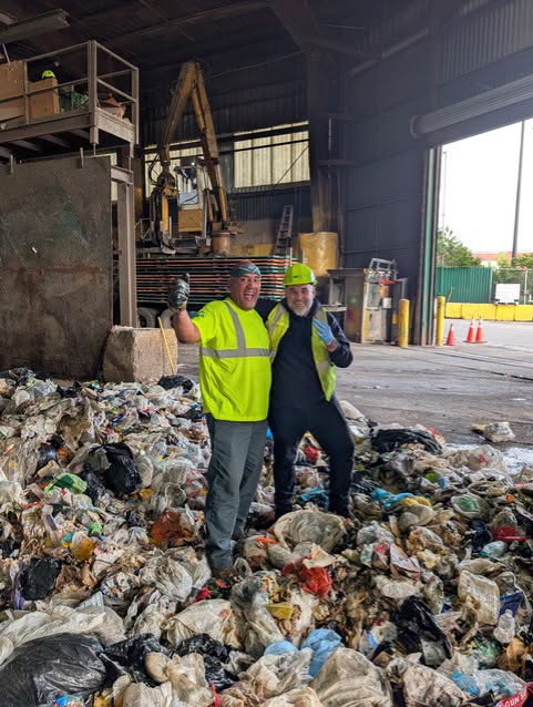 The two workers were all smiles in photos posted by New York City’s Sanitation Department Friday, announcing the remarkable discovery
