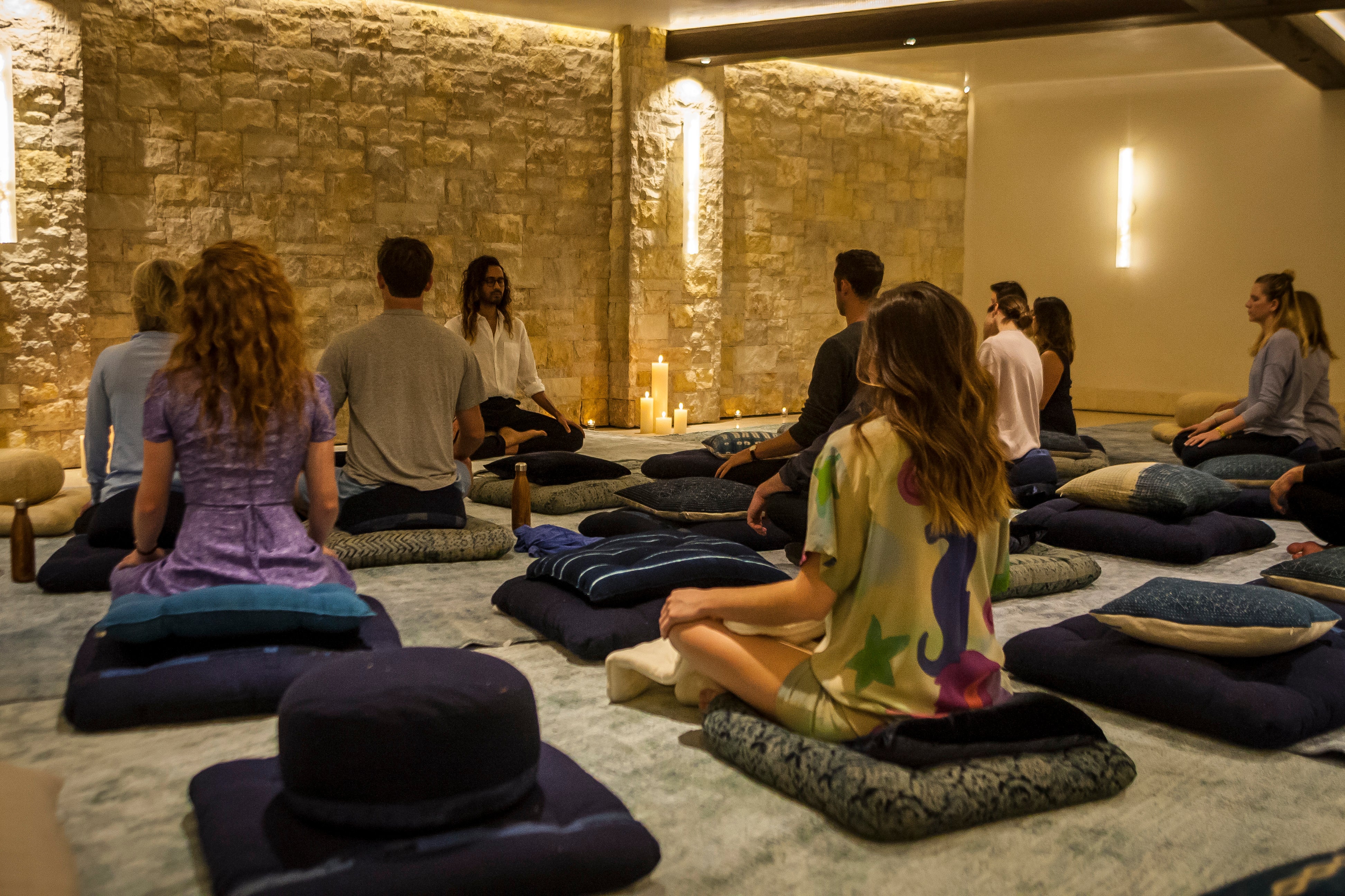 Guests participate in a meditation session