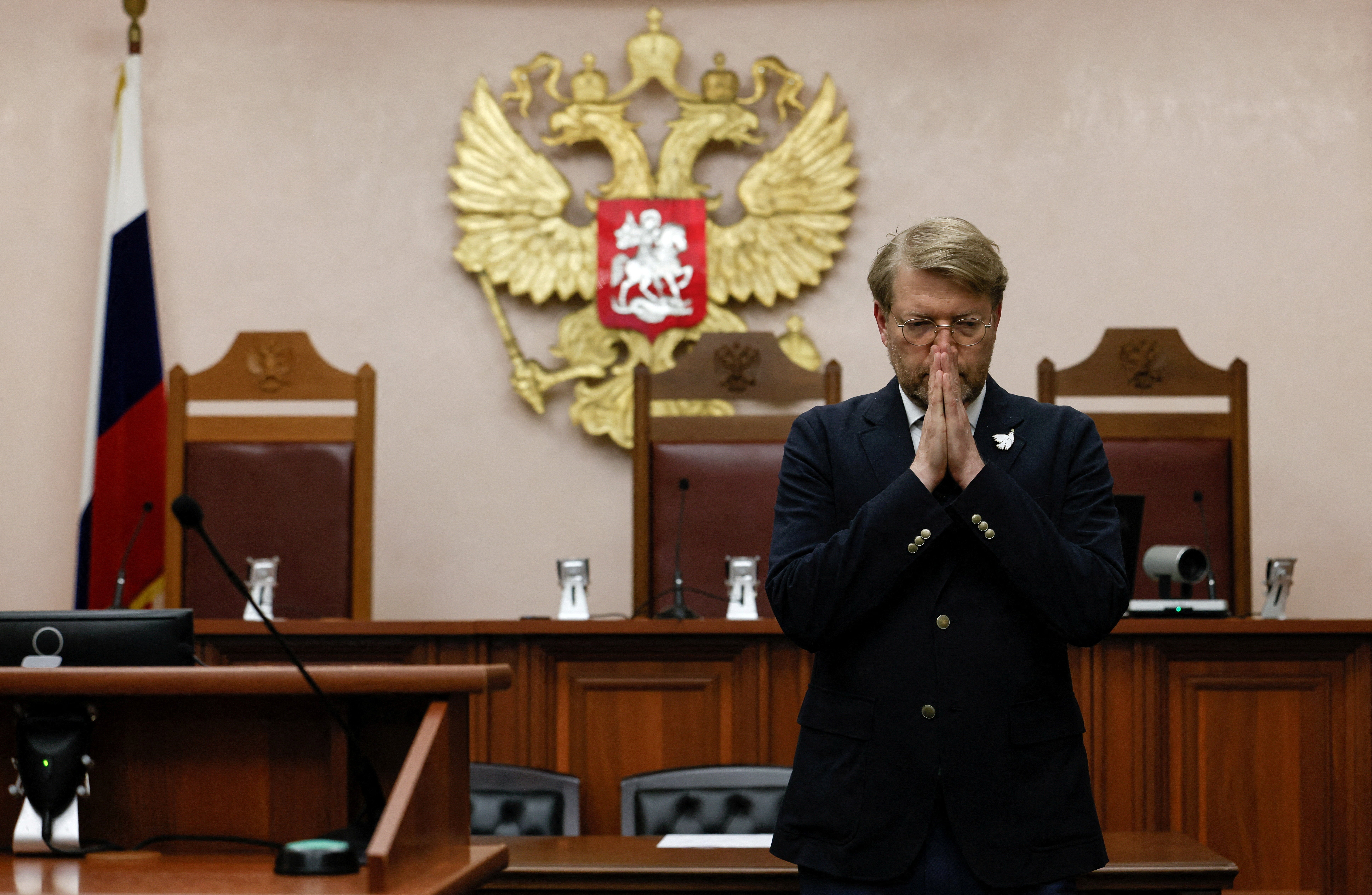 Chairman of Russia's Yabloko political party Nikolai Rybakov reacts after a hearing of the Supreme Court, which barred the party from contesting September's parliamentary elections