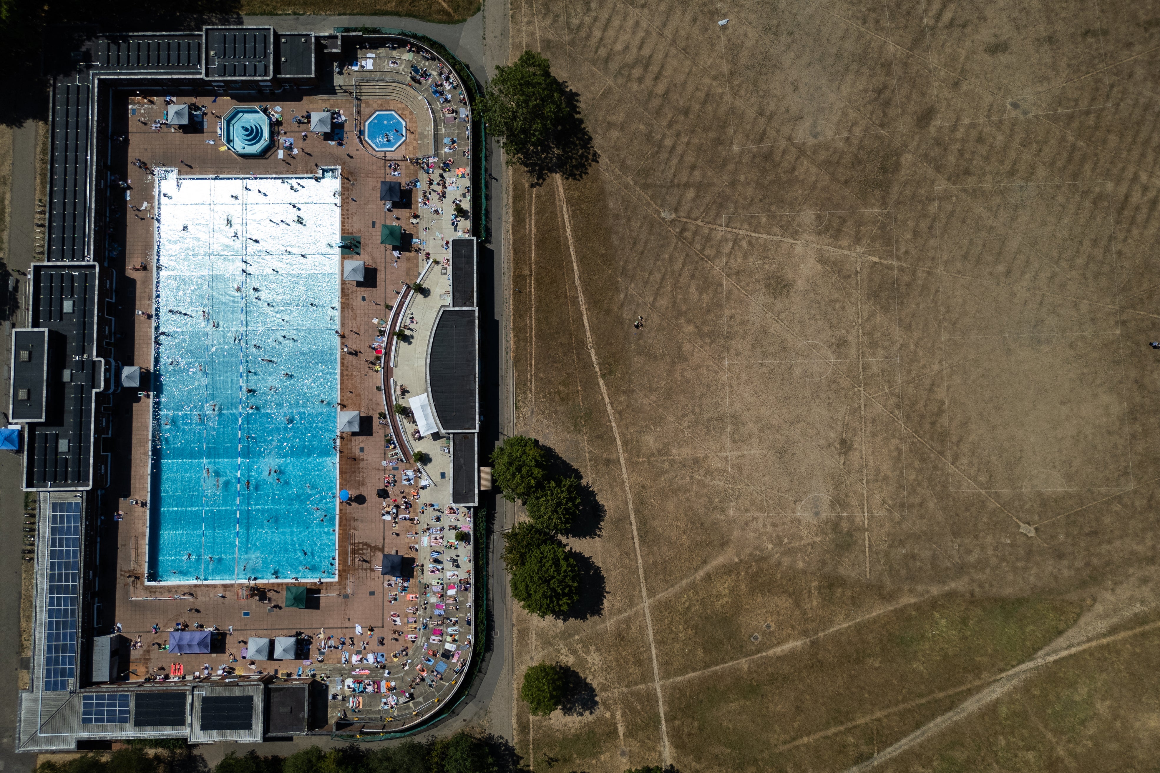 An aerial view shows swimmers using Parliament Hill Fields Lido in London (AFP/Getty)