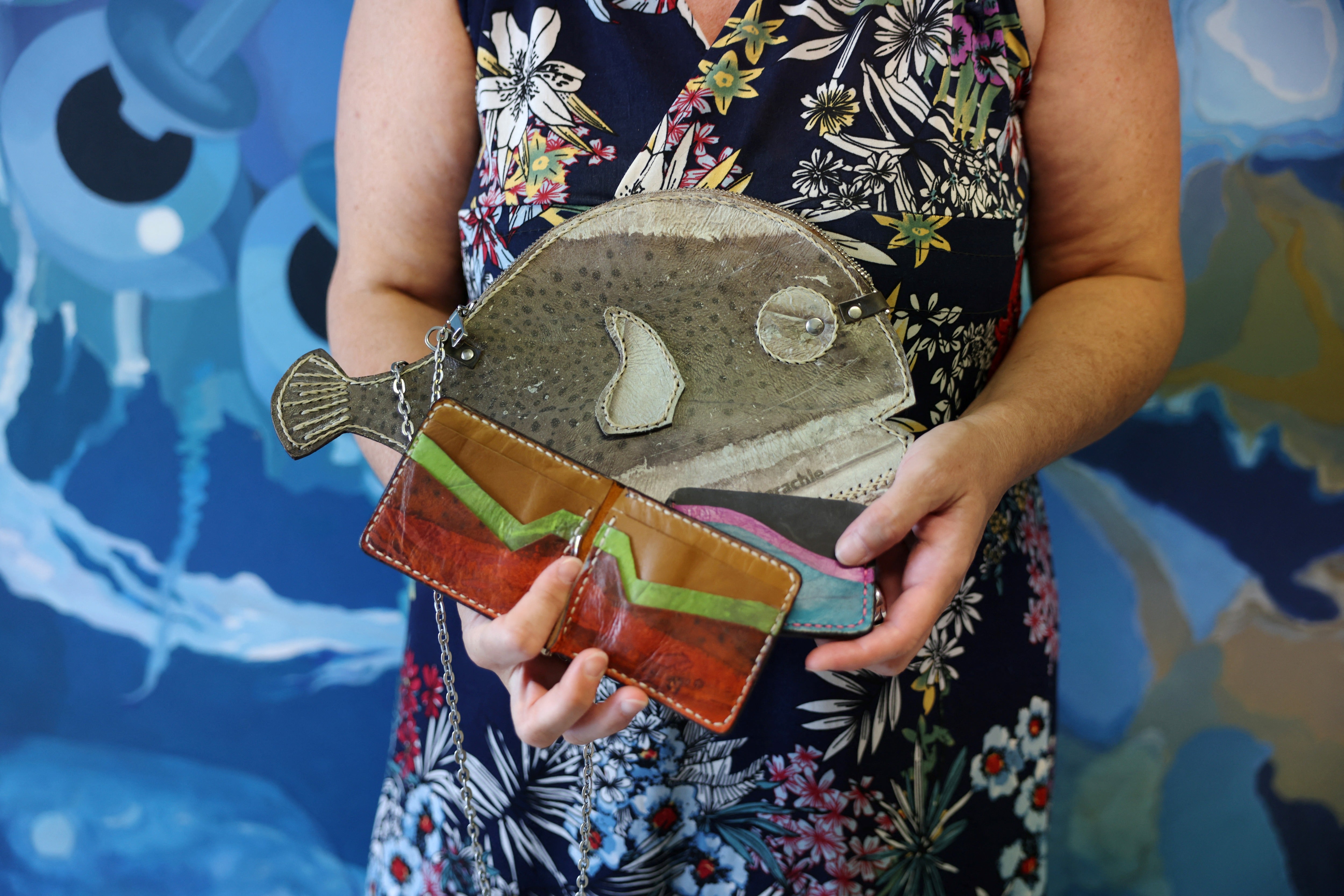 Ichthyologist Dr. Paraskevi Karachle holds bags made from pufferfish leather at the Hellenic Centre for Marine Research (HCMR) in Anavyssos, near Athens, Greece, July 28, 2026