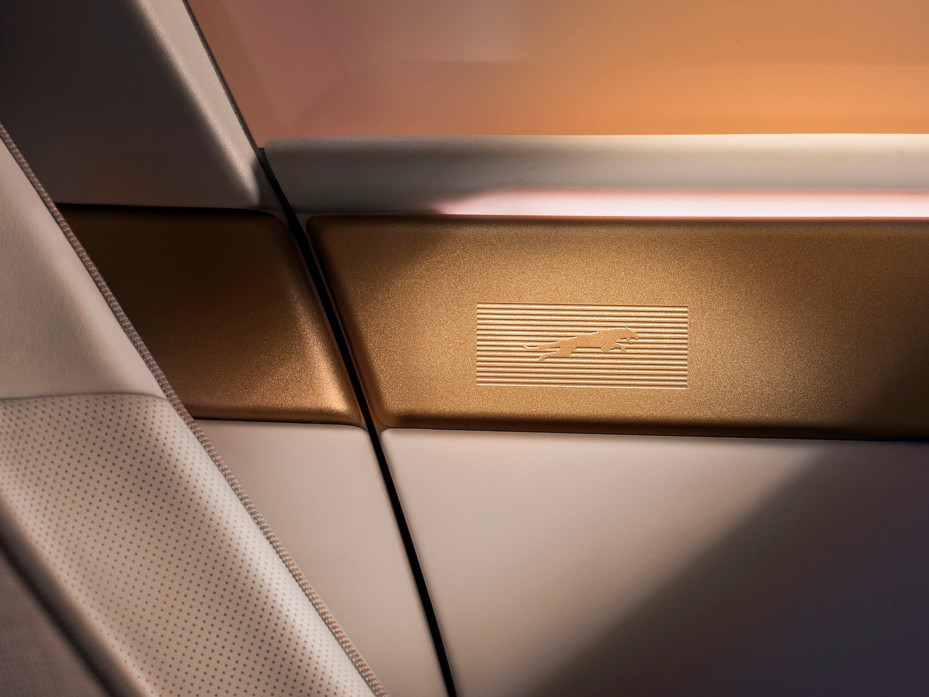 The new Jaguar leaper features subtly inset into brass on the top of the Type 01's doors (Jaguar)