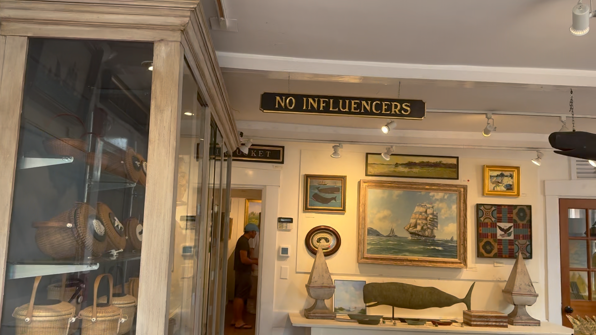 The 'tongue-in-cheek' sign that launched a class war on Nantucket is displayed in Four Winds Craft Guild