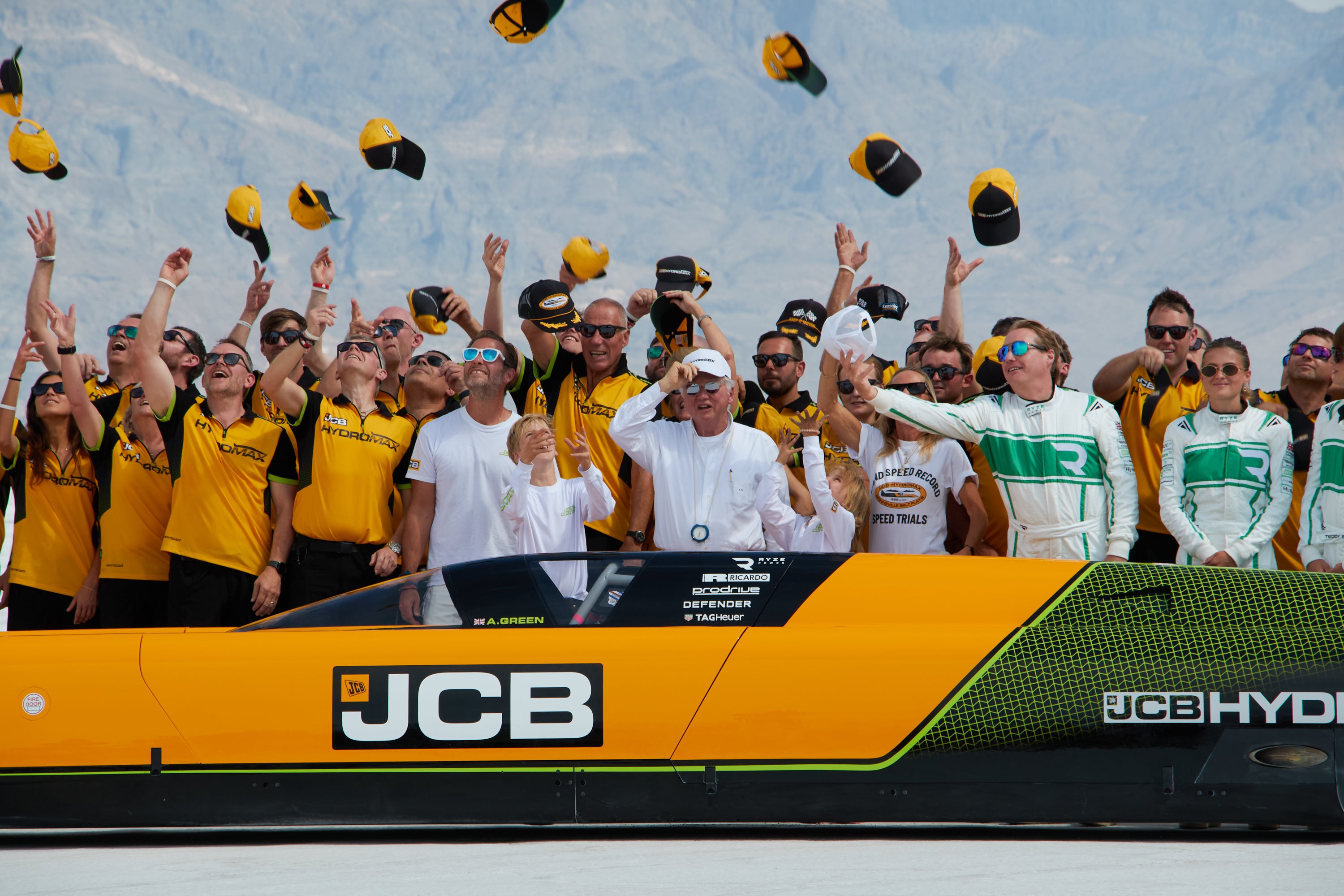 Andy Green and the JCB engineering team celebrate setting a new land speed record for a hydrogen-powered vehicle at the Bonneville Salt Flats in Utah, Tuesday, Aug. 11, 2026 (AP Photo/Hannah Schoenbaum)