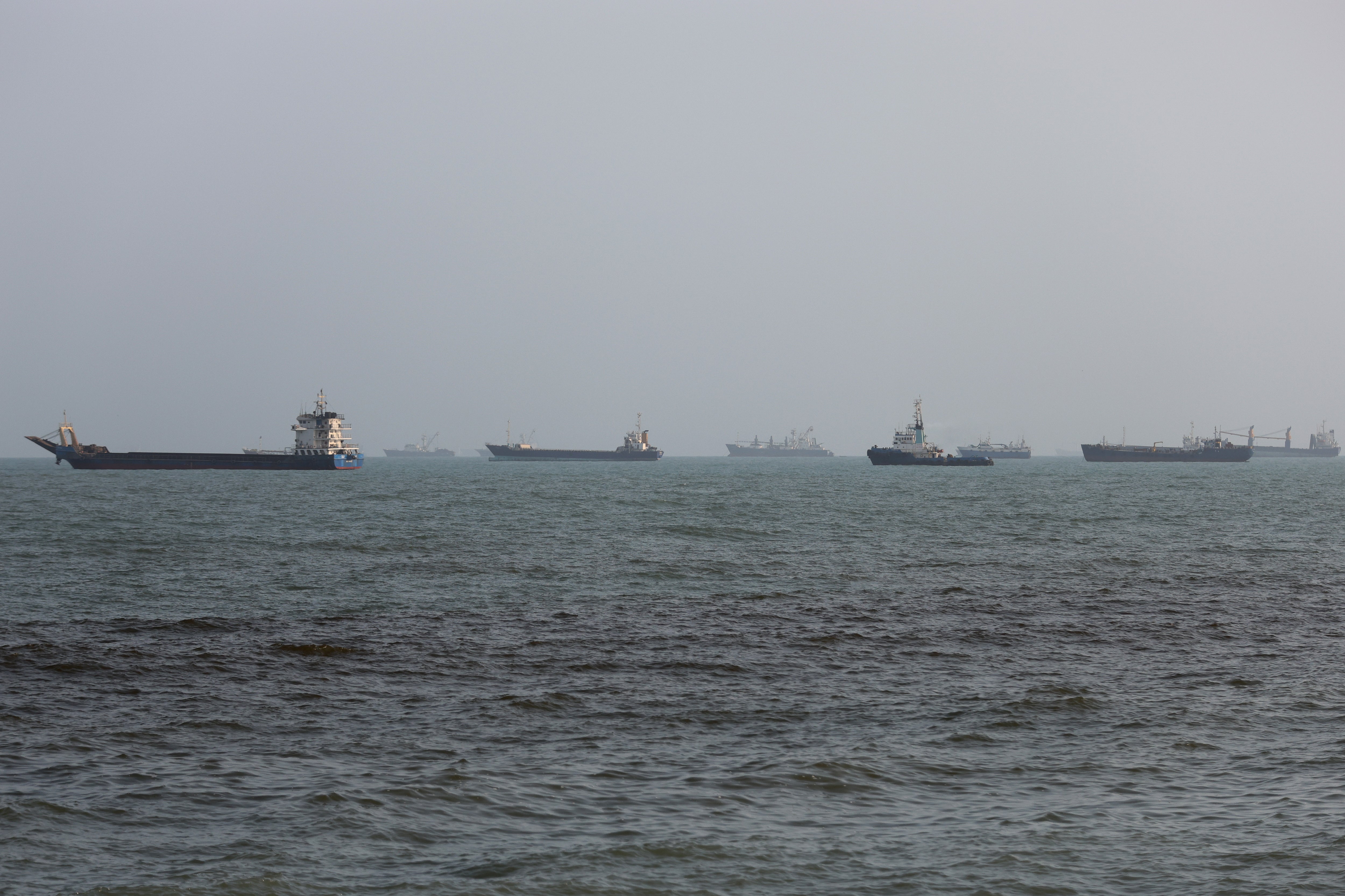 Ships are anchored in the Strait of Hormuz as it remains closed due to Trump’s war against Iran
