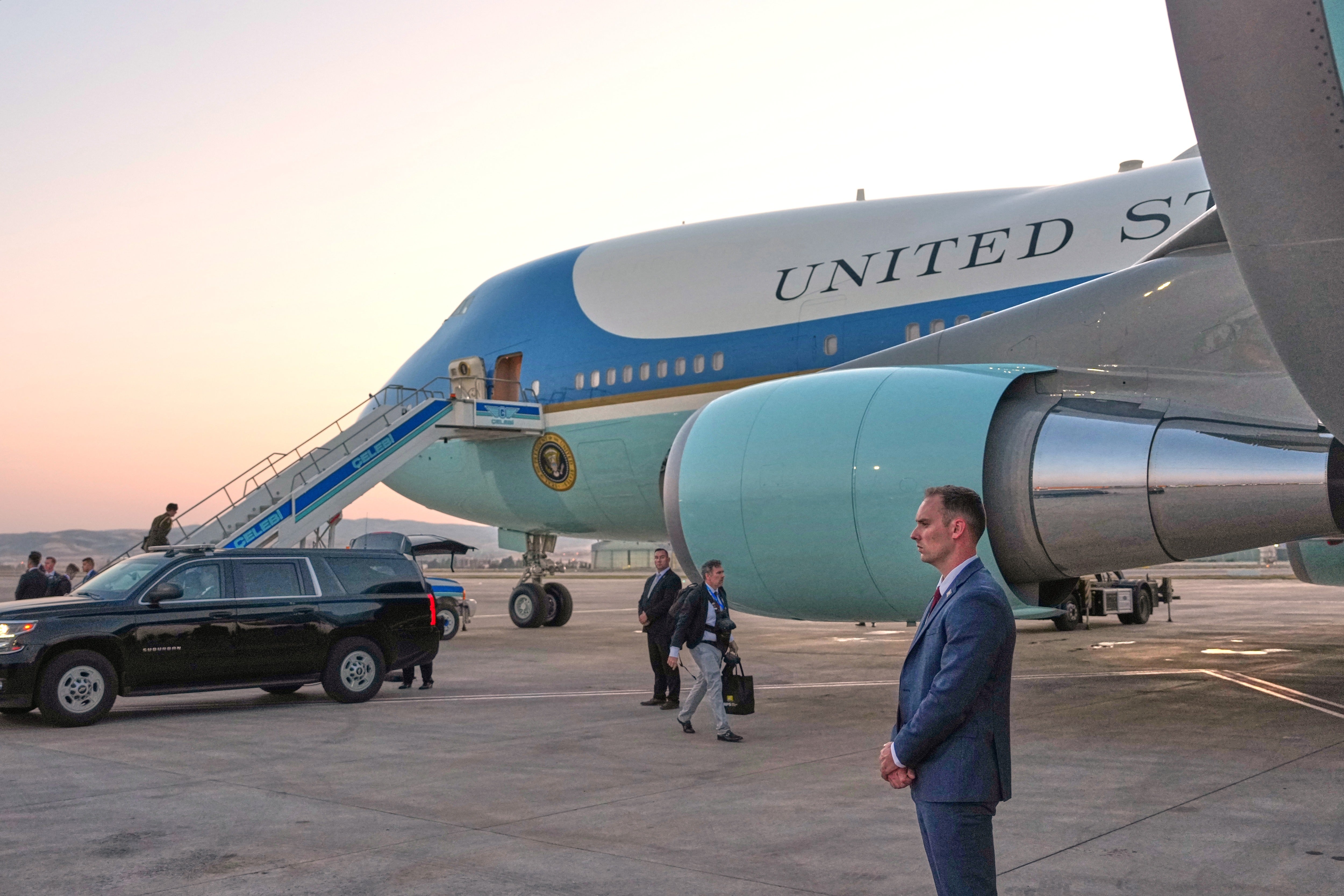 The catering truck used to transport President  Trump to the smaller plane in which he secretly left Turkey is seen parked next to the legacy Air Force One at Ankara Esenboga Airport on July 8 (AP)