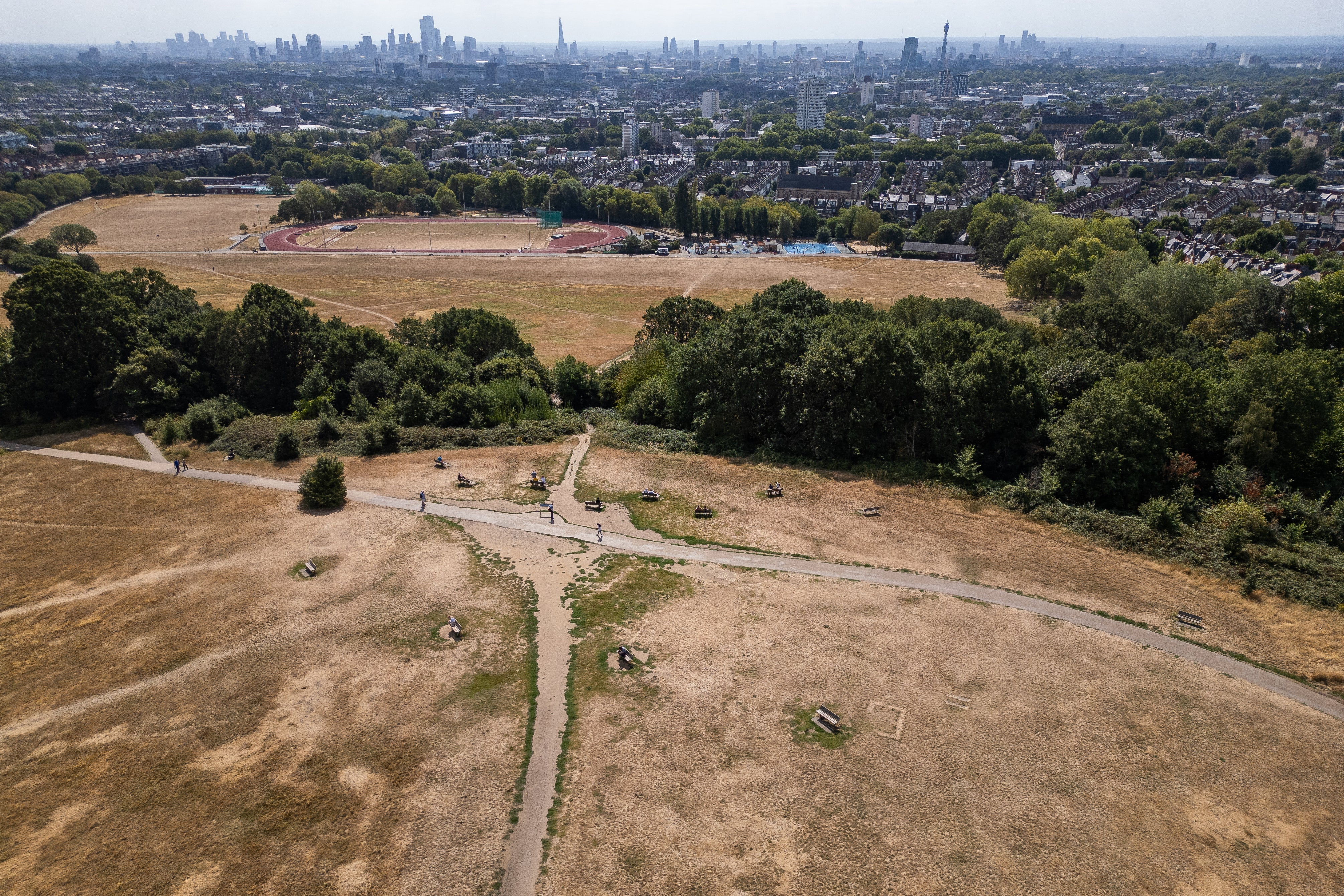 An aerial view shows the dirt paths and scorched grass of Parliament Hill on Hampstead Heath l