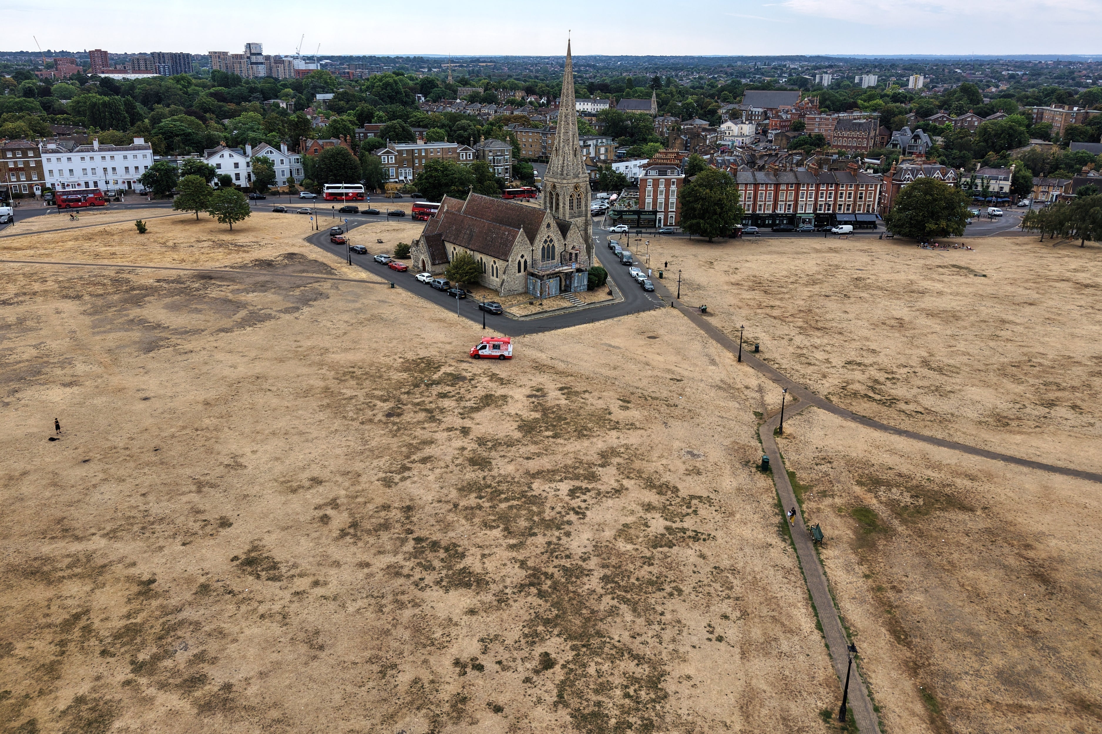 Dried vegetation is seen surrounding the All Saints church in Blackheath