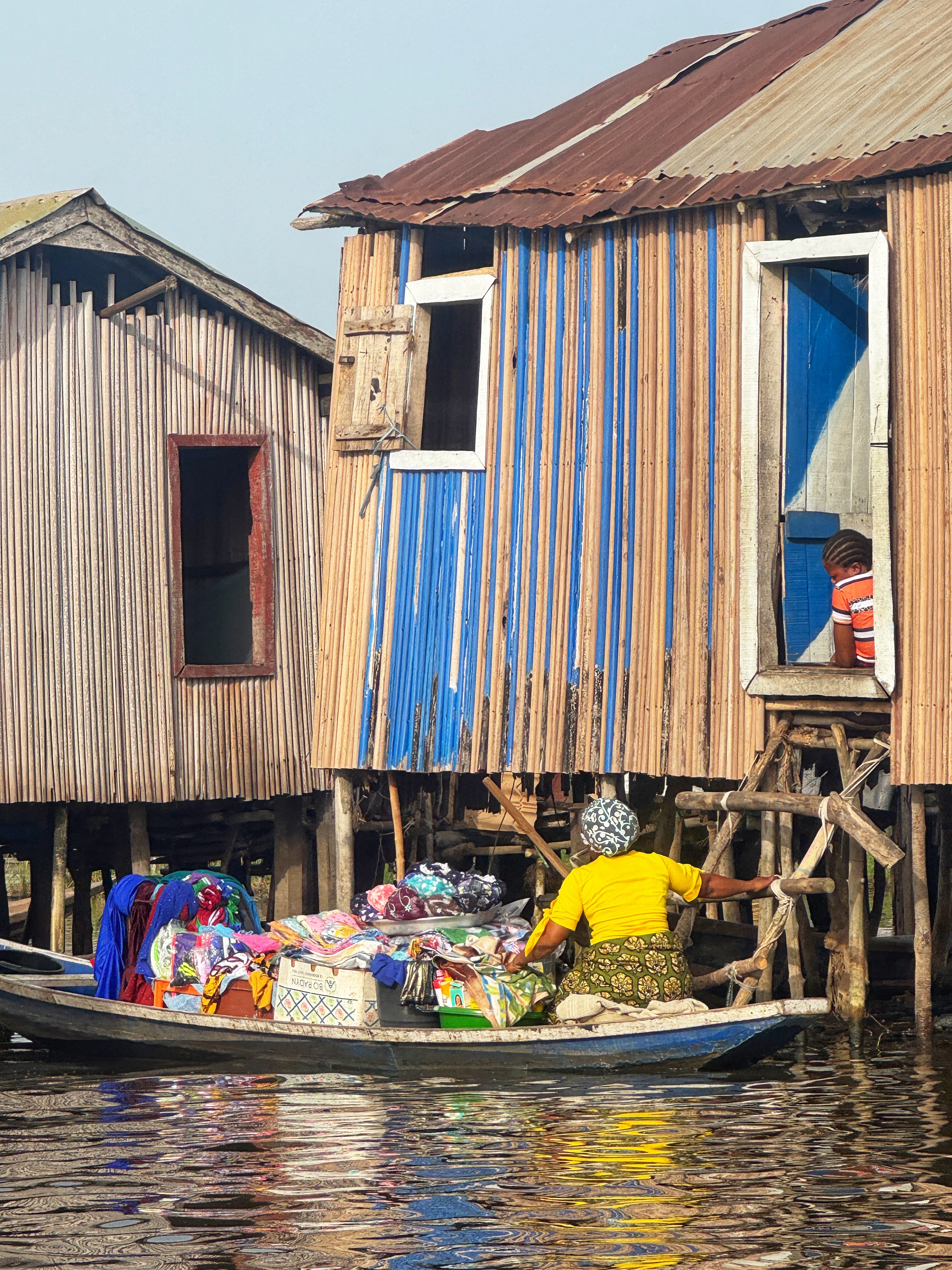 25,000 people live, work and socialise in buildings hoisted on stilts above Lake Nokoué