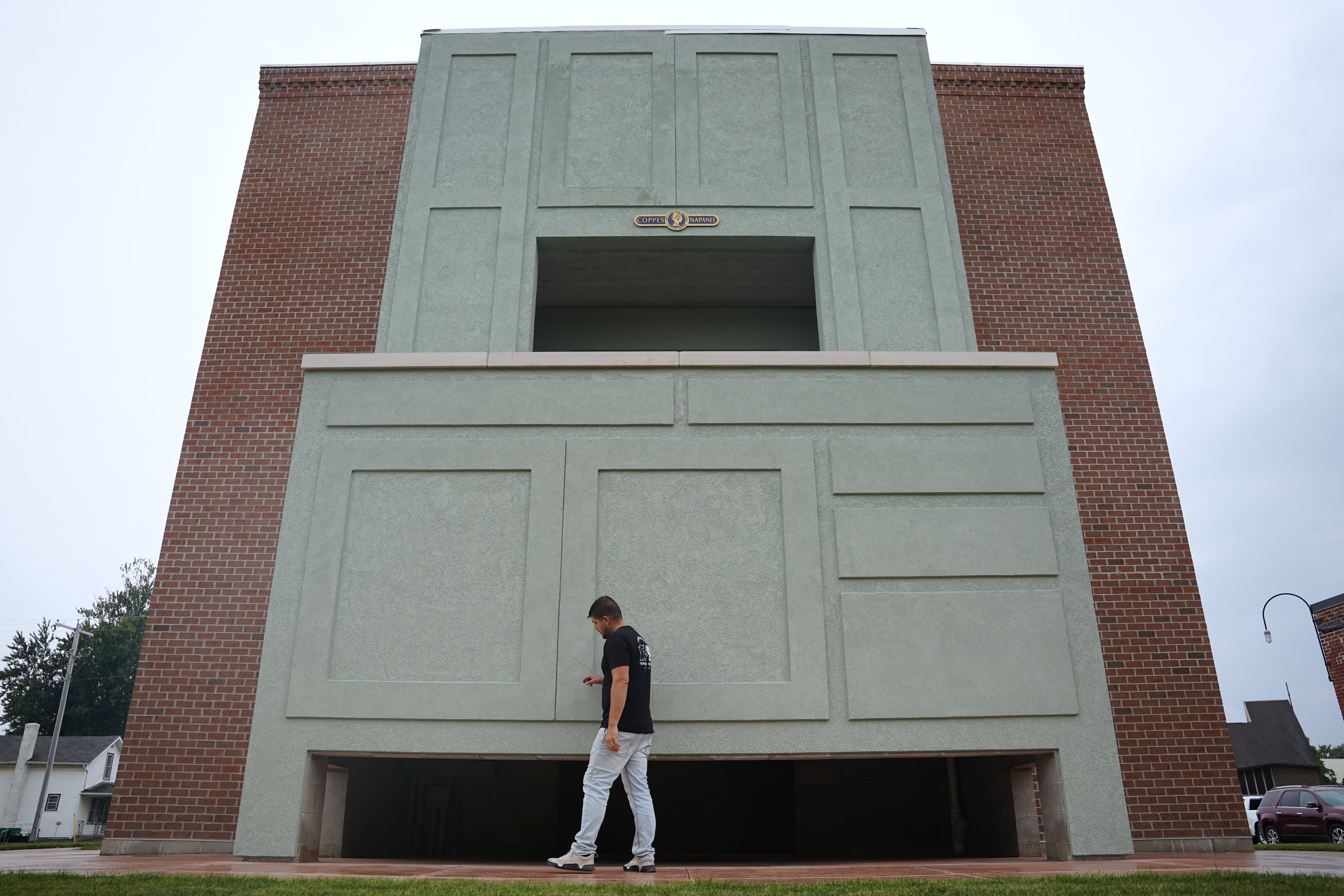 Wesley Mast, owner and president of Coppes Napanee, walks past a giant replica of a Hoosier cabinet in Nappanee, Indiana (AP Photo/Obed Lamy)