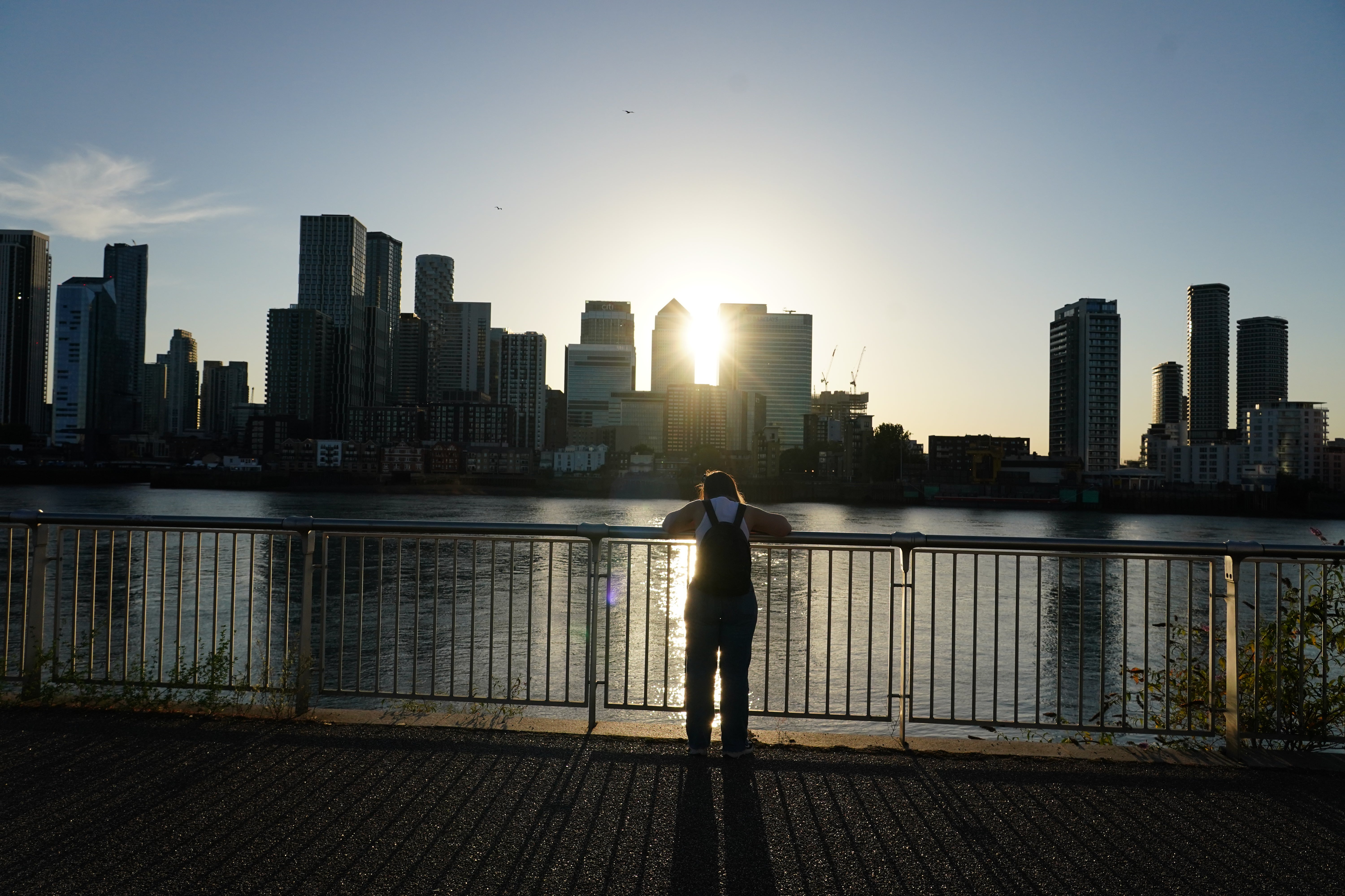 The sun over Canary Wharf, London during the solar eclipse (PA)