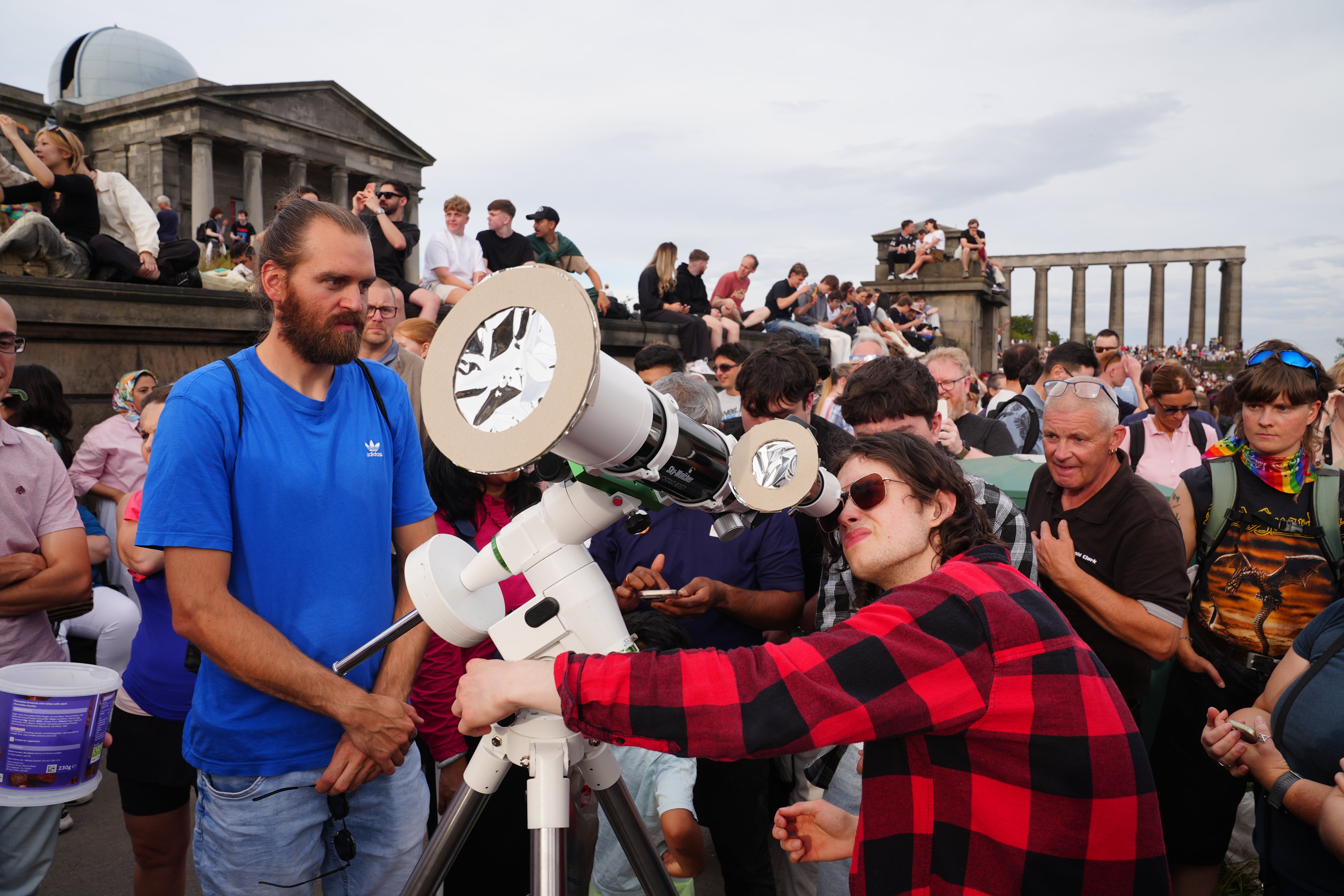People gathering to watch the solar eclipse on Calton Hill, Edinburgh (Jane Barlow/PA)