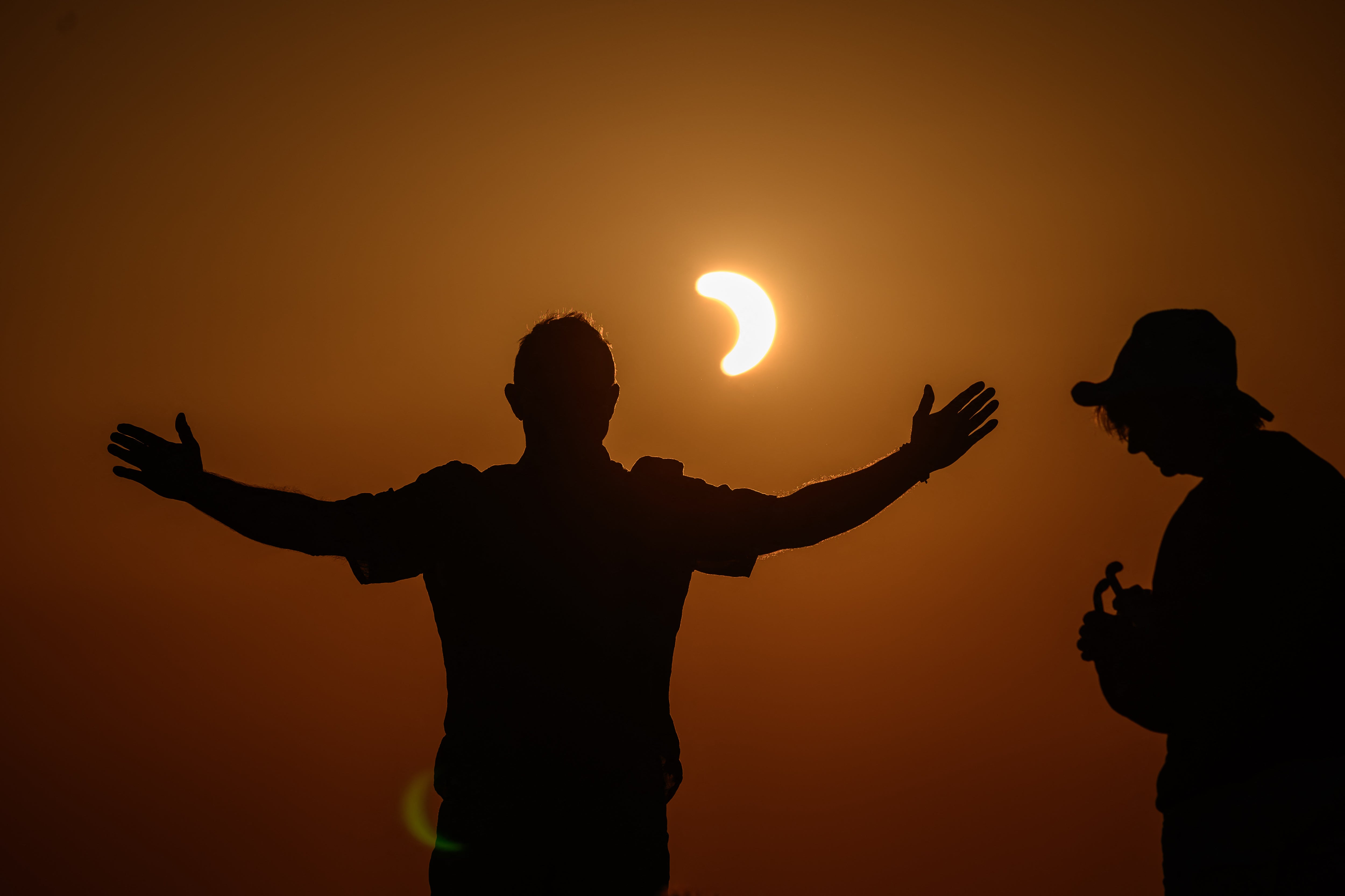 People watch a partial solar eclipse at the Chasseral peak, above Nods, northwestern Switzerland (AFP/Getty)