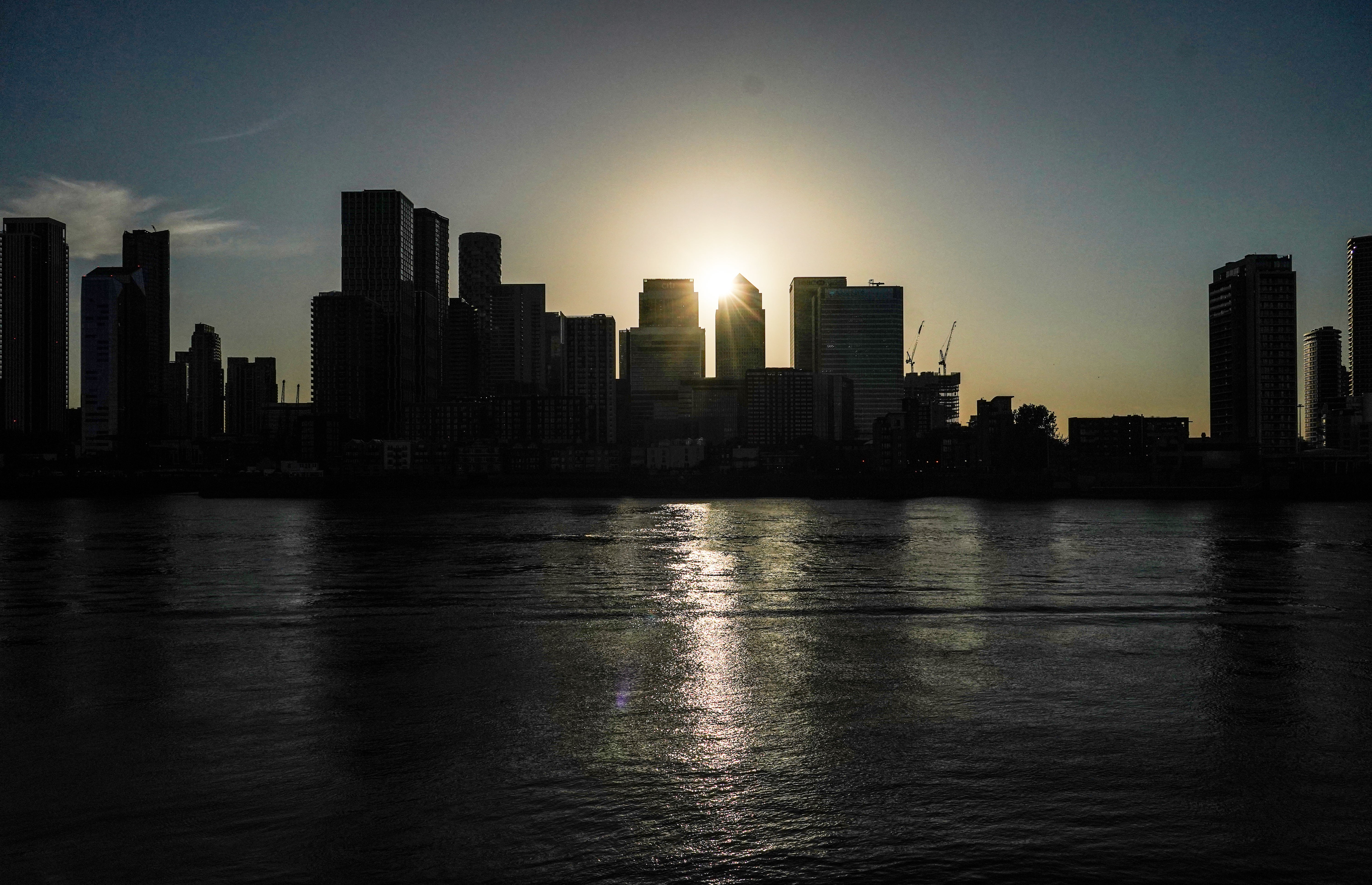 The solar eclipse by Canary Wharf (Ian West/PA)