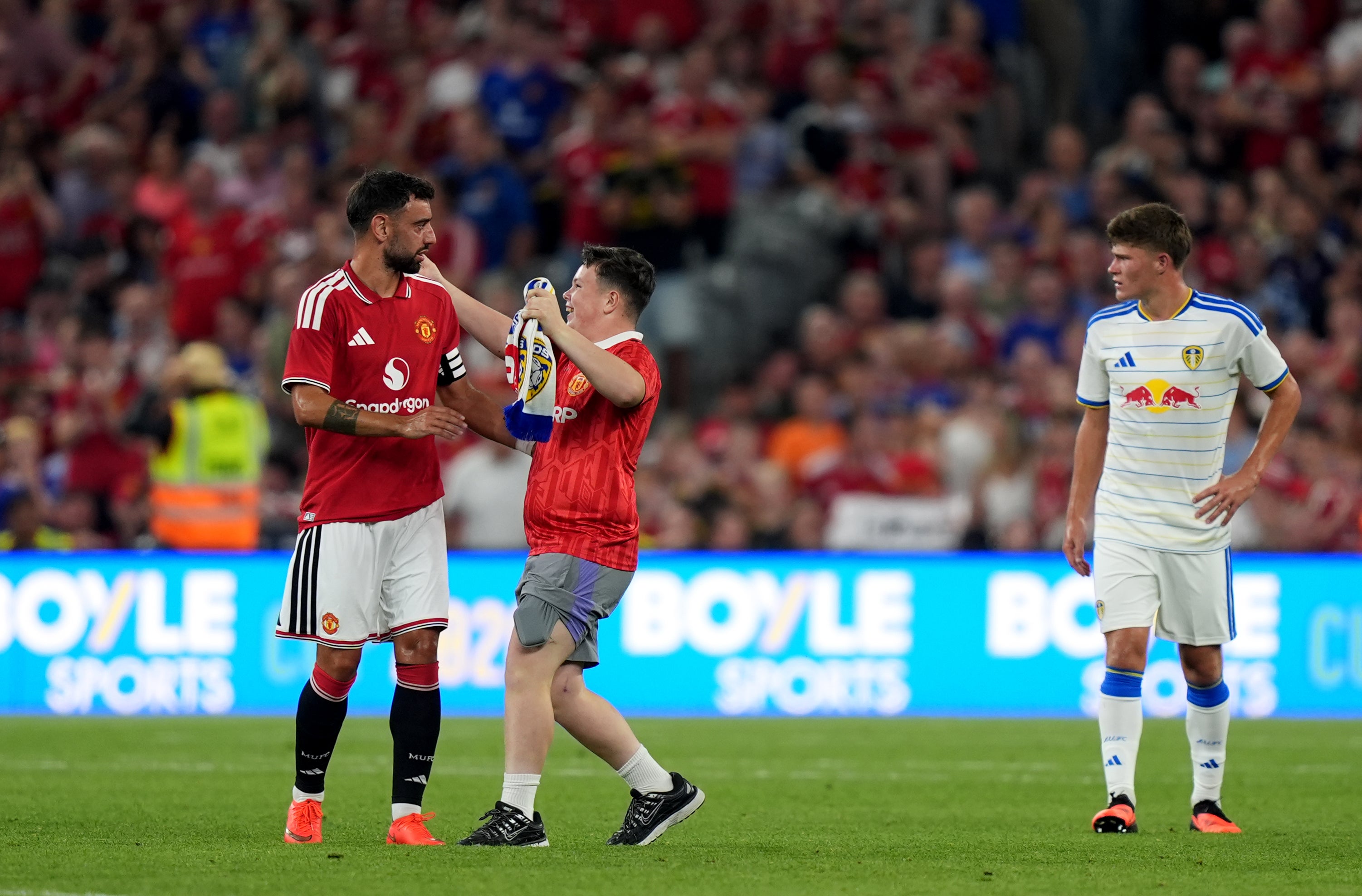 The match ended when a number of young fans ran onto the pitch (Niall Carson/PA)