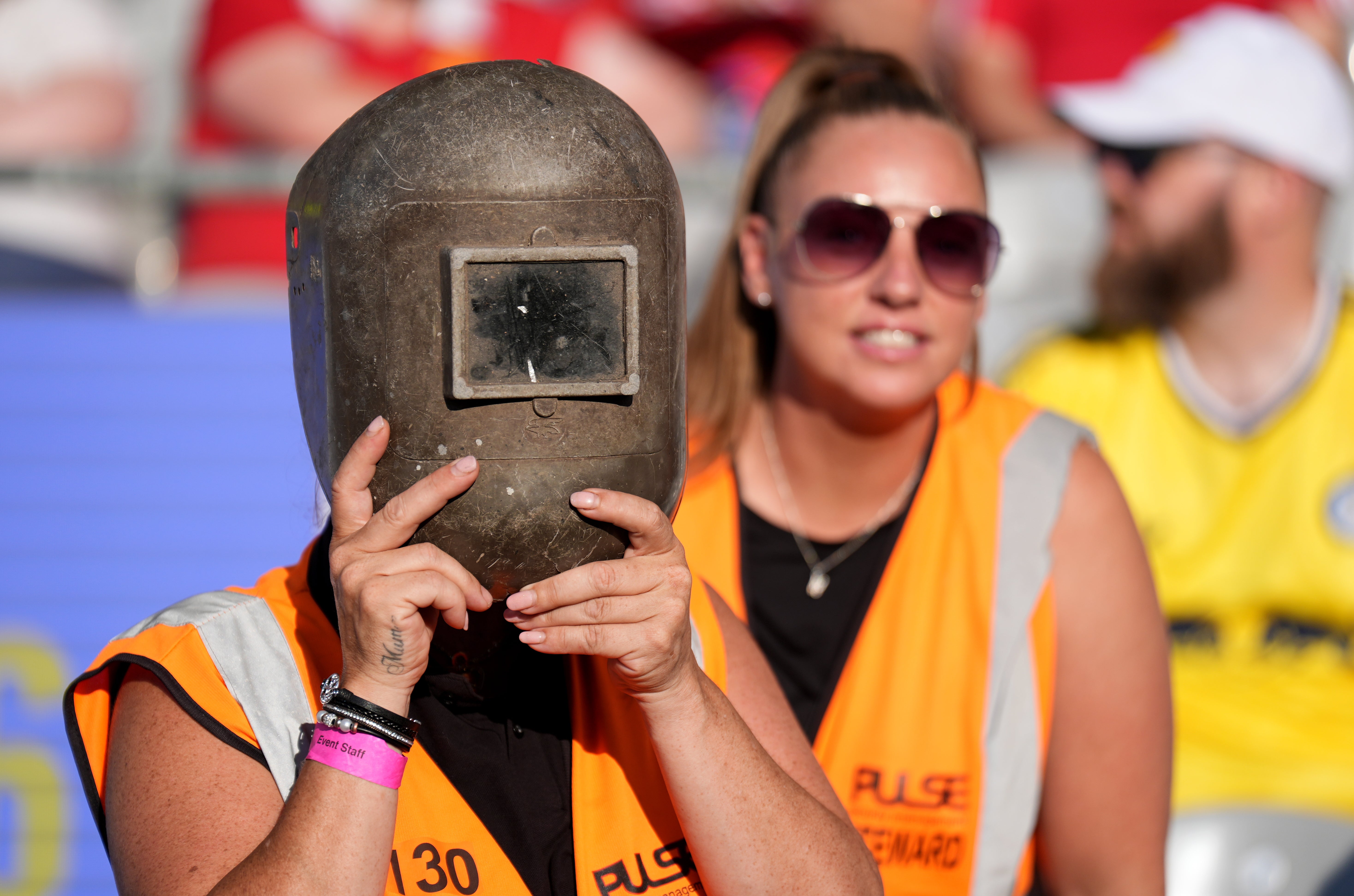 Stewards wearing welding helmets at Croke Park (Niall Carson/PA) (PA Wire)
