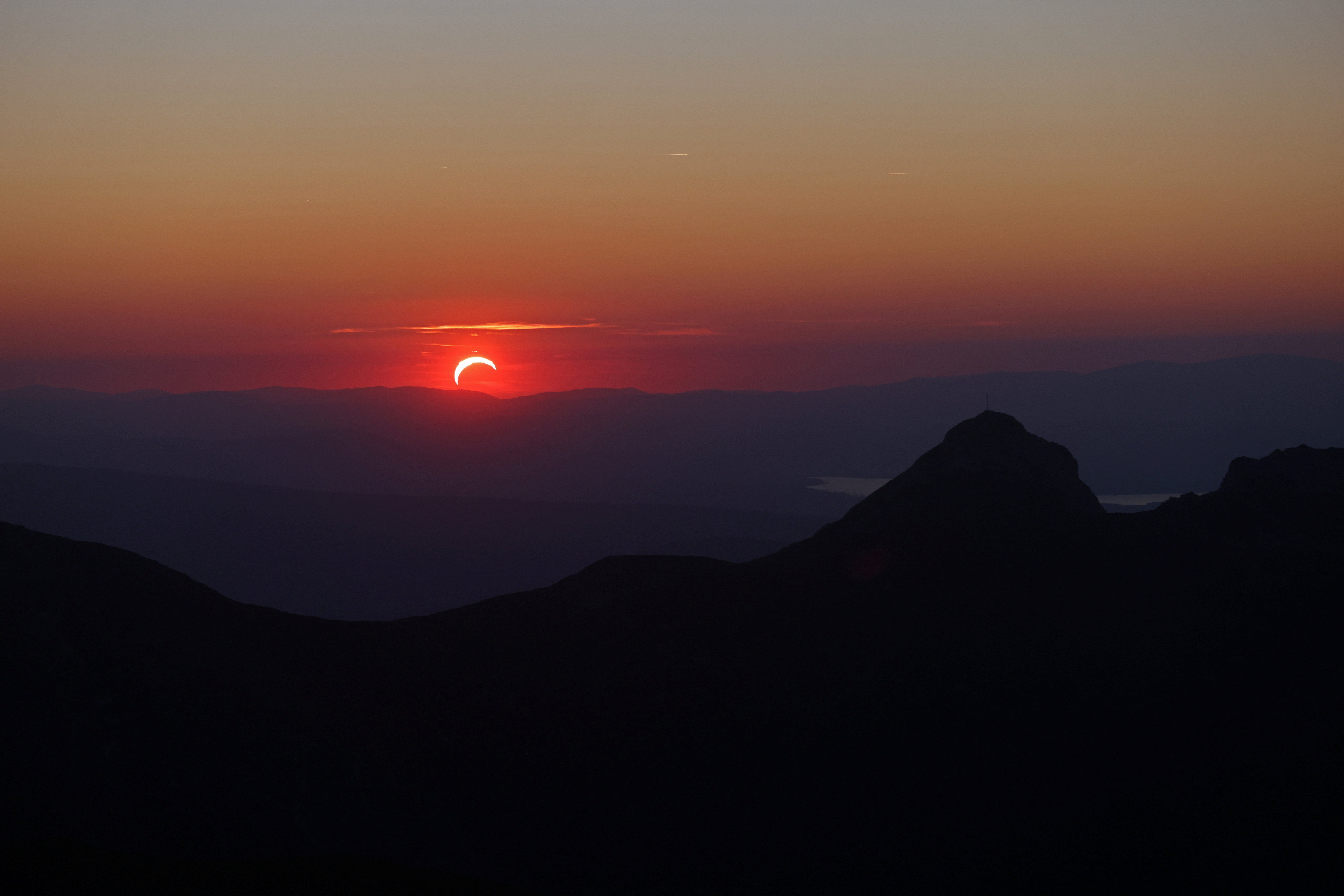 The sunset from Kasprowy Wierch mountain during partial solar eclipse in Tatra National Park near Zakopane, Poland, August 12, 2026 (Reuters)