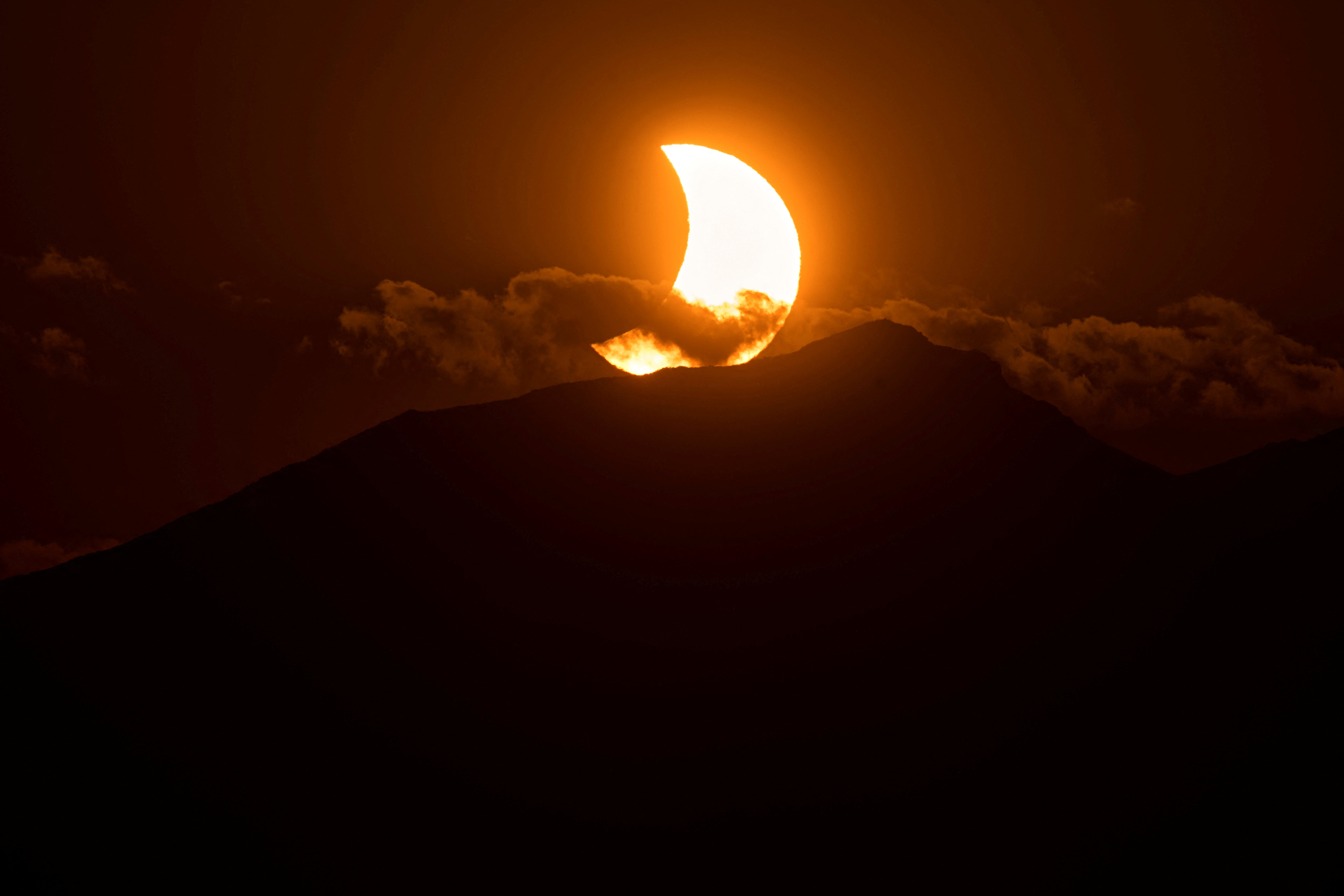 The moon partially covering the sun during the 2026 eclipse in Spain (Reuters)