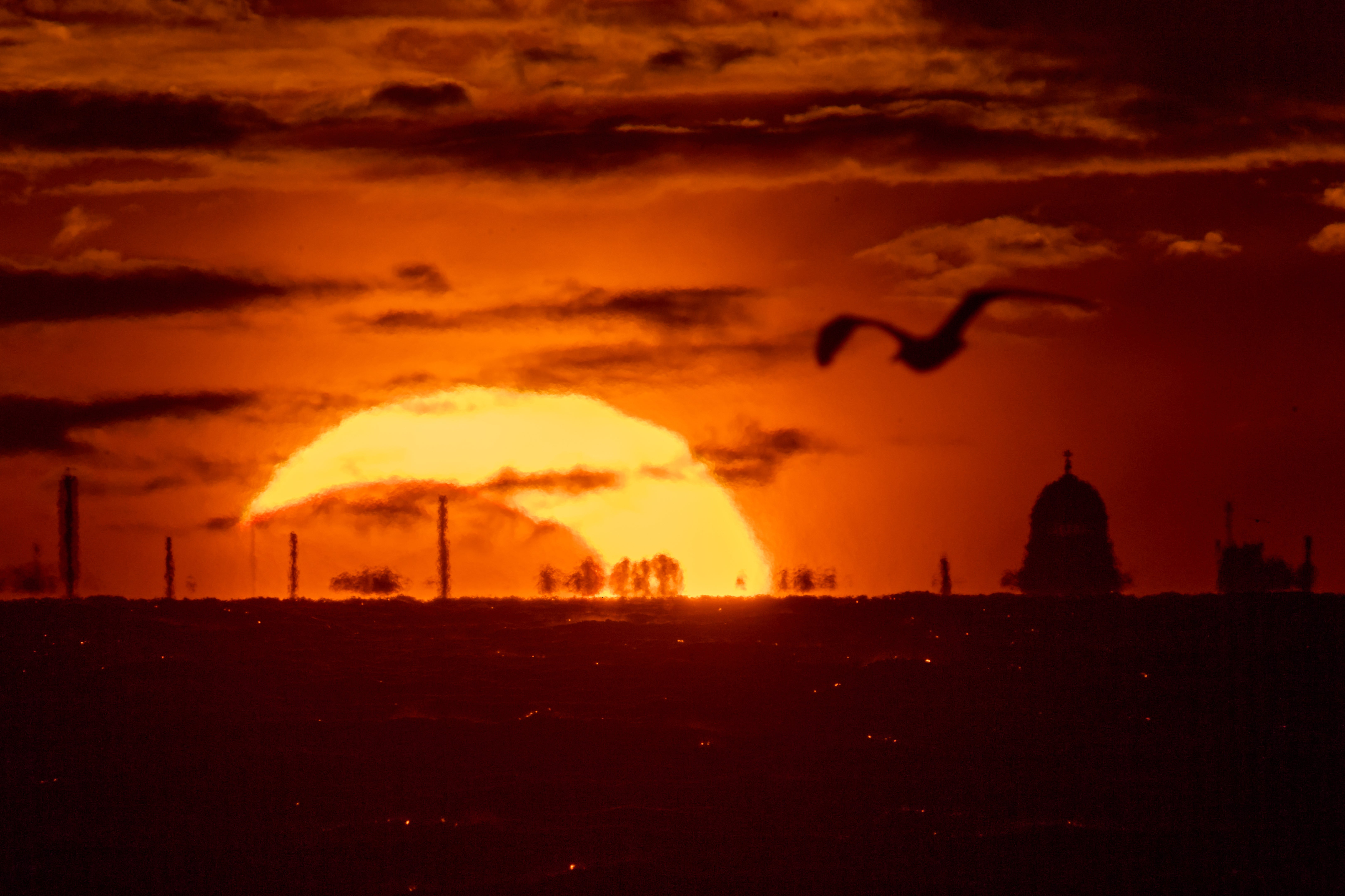 The best pictures as stargazers treated to astral delight with eclipse and meteor shower on same evening