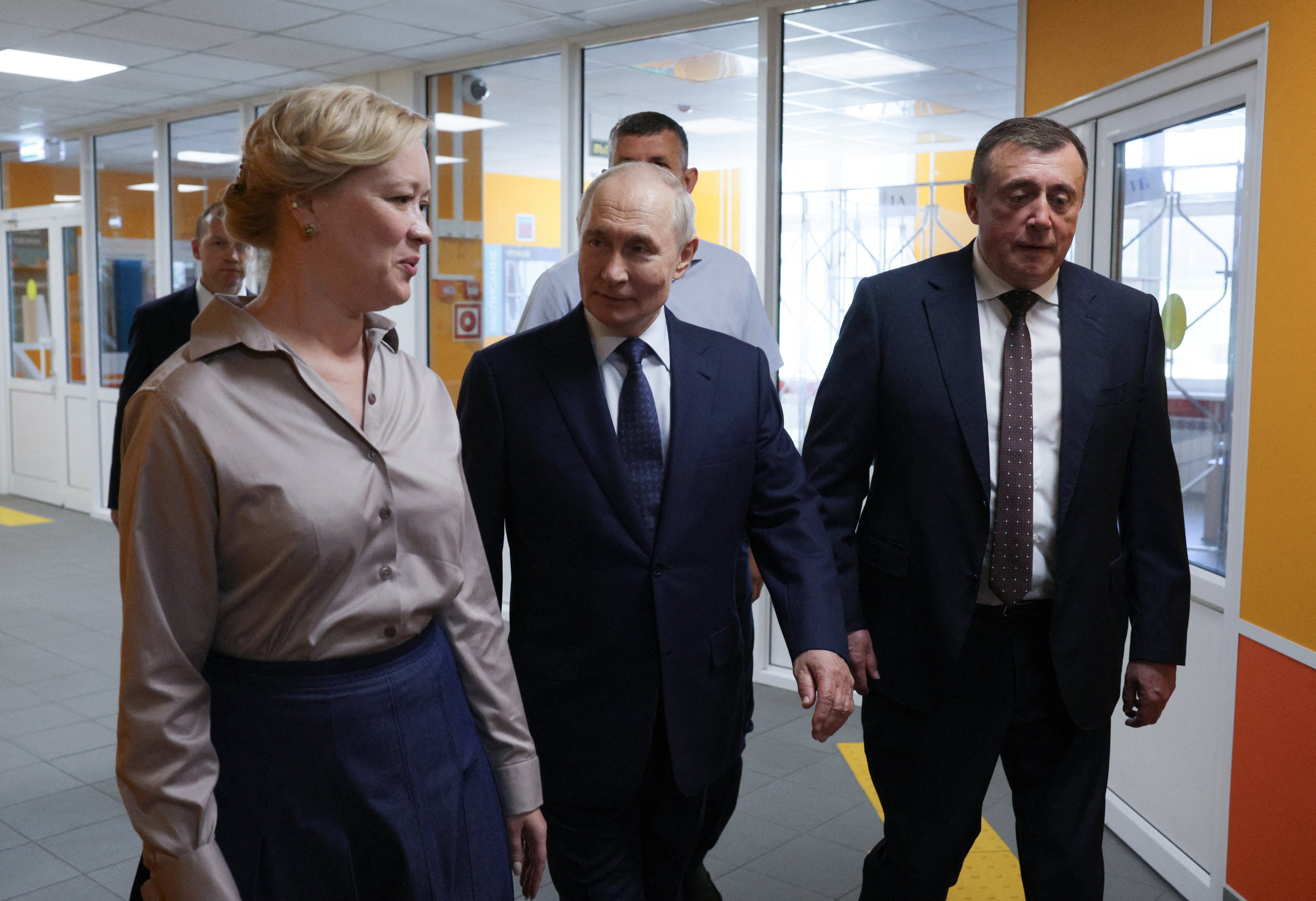 In this pool photograph distributed by the Russian state agency Sputnik, Russia's President Vladimir Putin visits a school on Iturup island, one of four islands in the contested chain known as the Kuril Islands in Russia and the Northern Territories in Japan, on August 13, 2026. (Photo by Gavriil Grigorov / POOL / AFP via Getty Images)