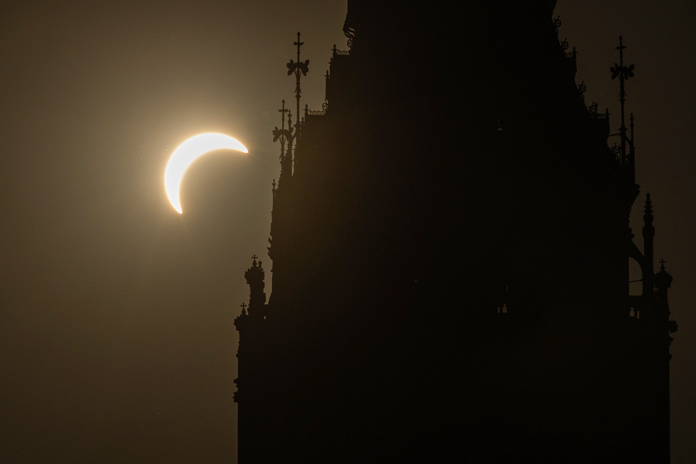 A near total solar eclipse, with more than 90 per cent of the Sun blocked by the Moon across Britain, is pictured behind Big Ben
