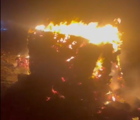 The attackers set fire to a large pile of livestock feed which is used to feed the residents' sheep