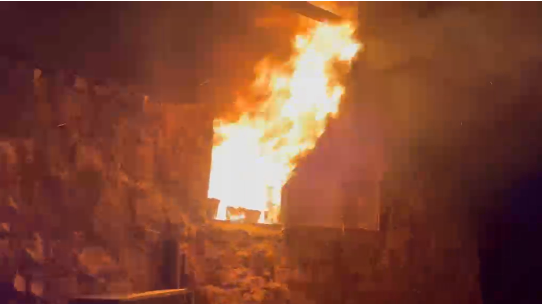 Footage of the scene showed flames bursting from a the window inside a home