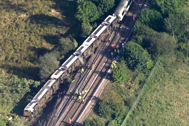 Passengers injured as train derails, flinging carriages sideways