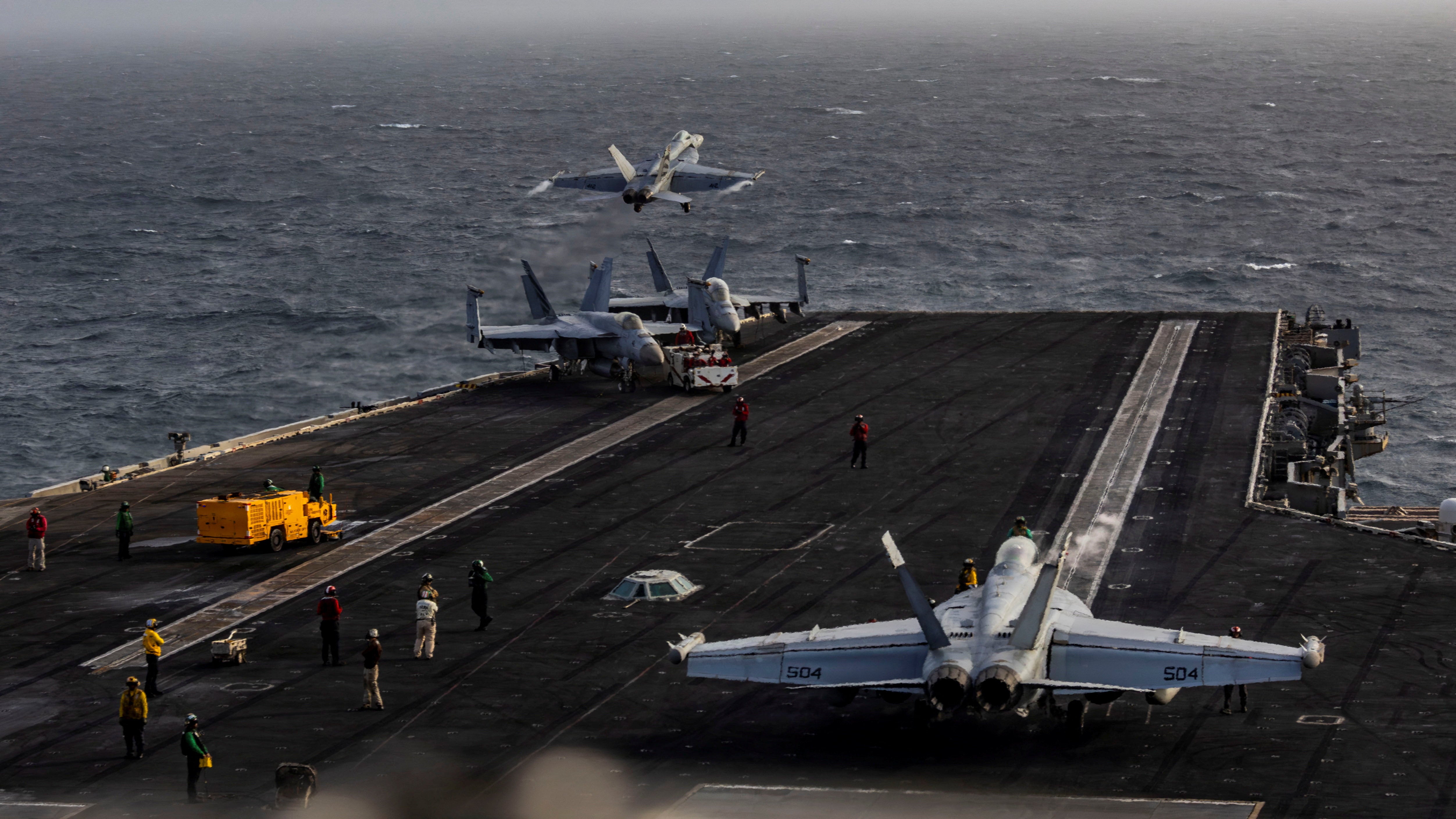 Crew aboard the aircraft carrier are reportedly so unhappy that some have attempted to jump off