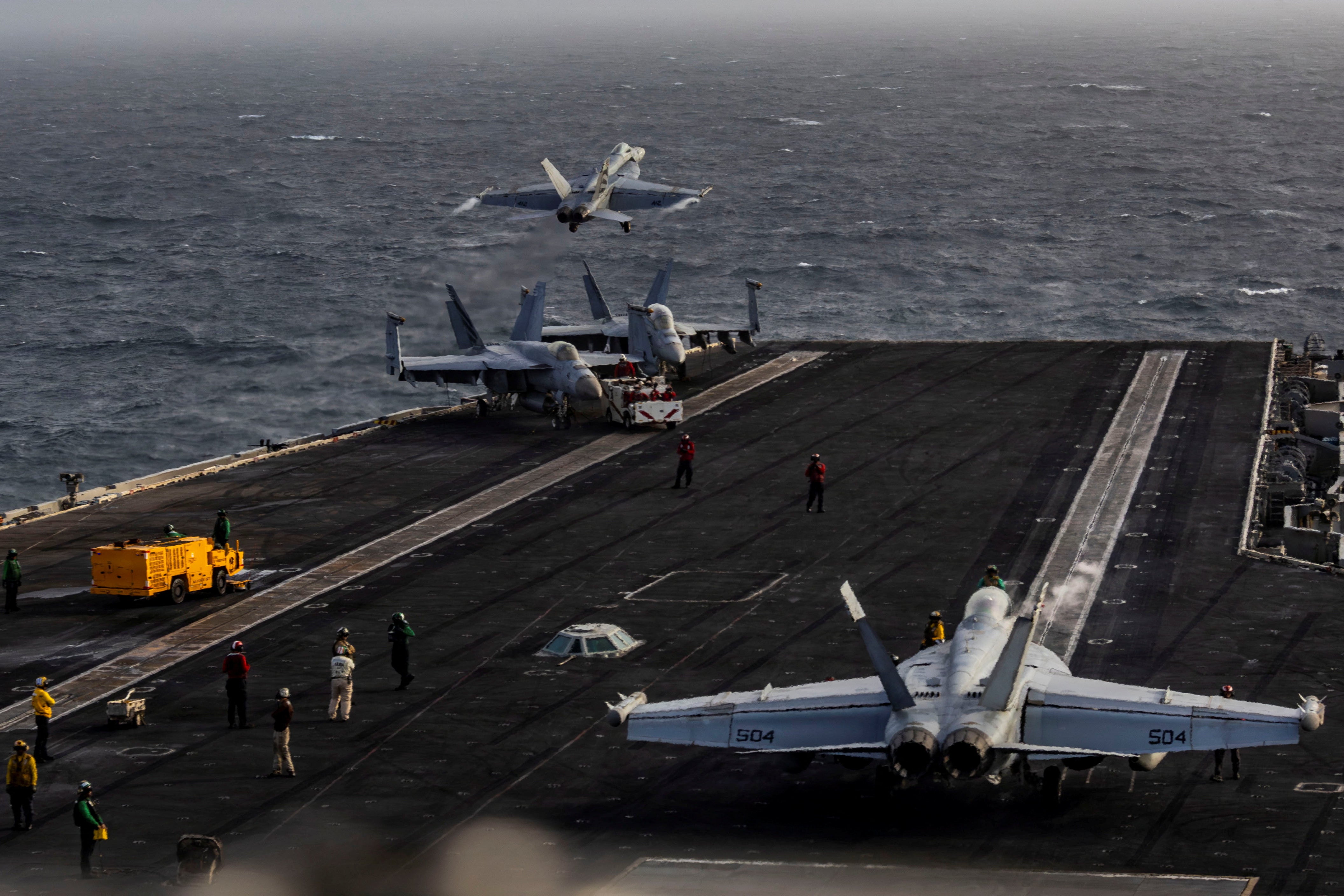 Crew aboard the aircraft carrier are reportedly so unhappy that some have attempted to jump off (Reuters)
